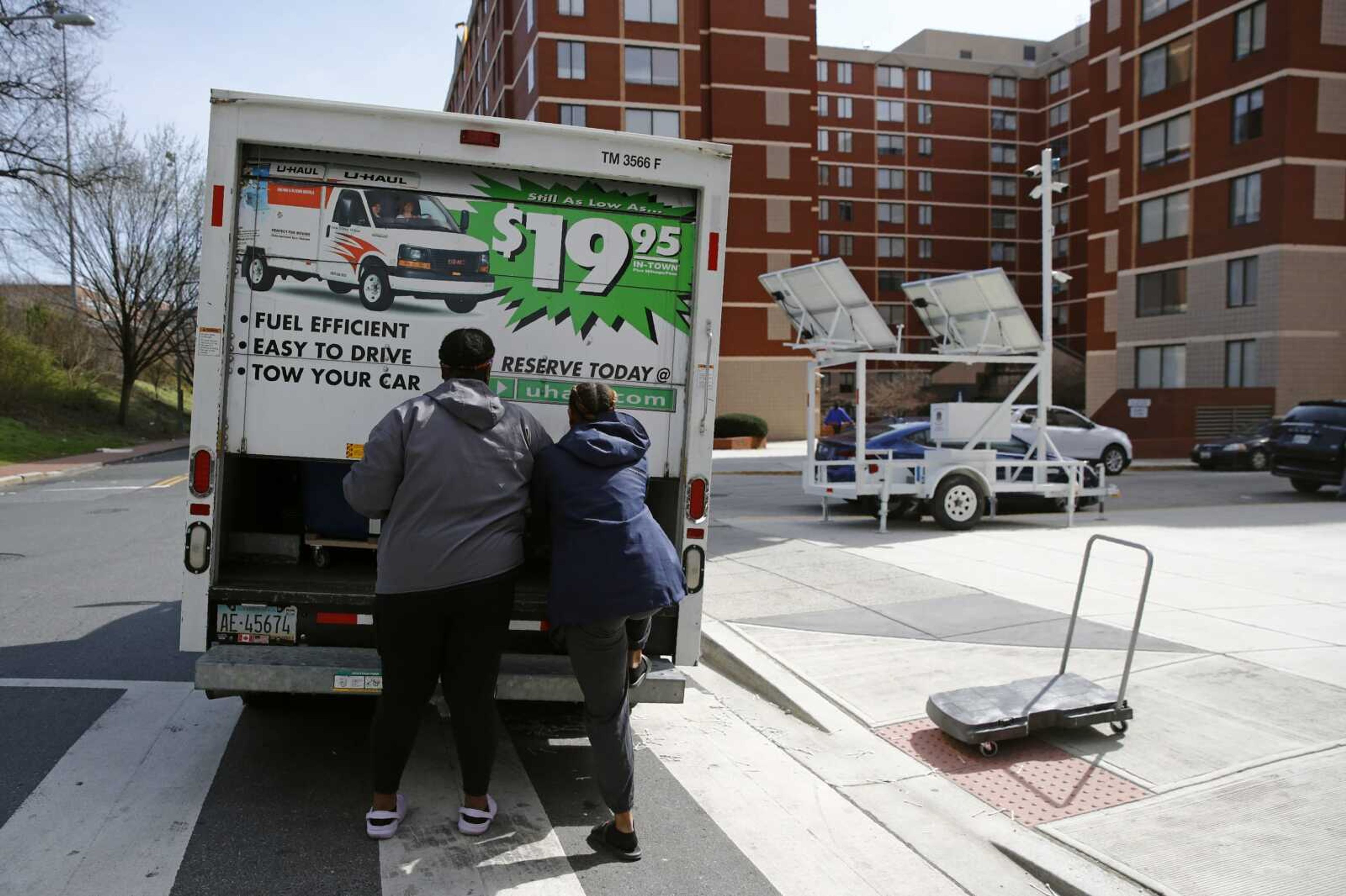 Students finish loading belongings into a U-Haul truck as they move out of their dorm March 18, 2020, in Washington. The proportion of people who moved over the past year fell to its lowest rate in the 73 years that it has been tracked, in a refutation of popular anecdotes there was a great migration in the U.S. during the pandemic, according to figures released Wednesday by the U.S. Census Bureau.