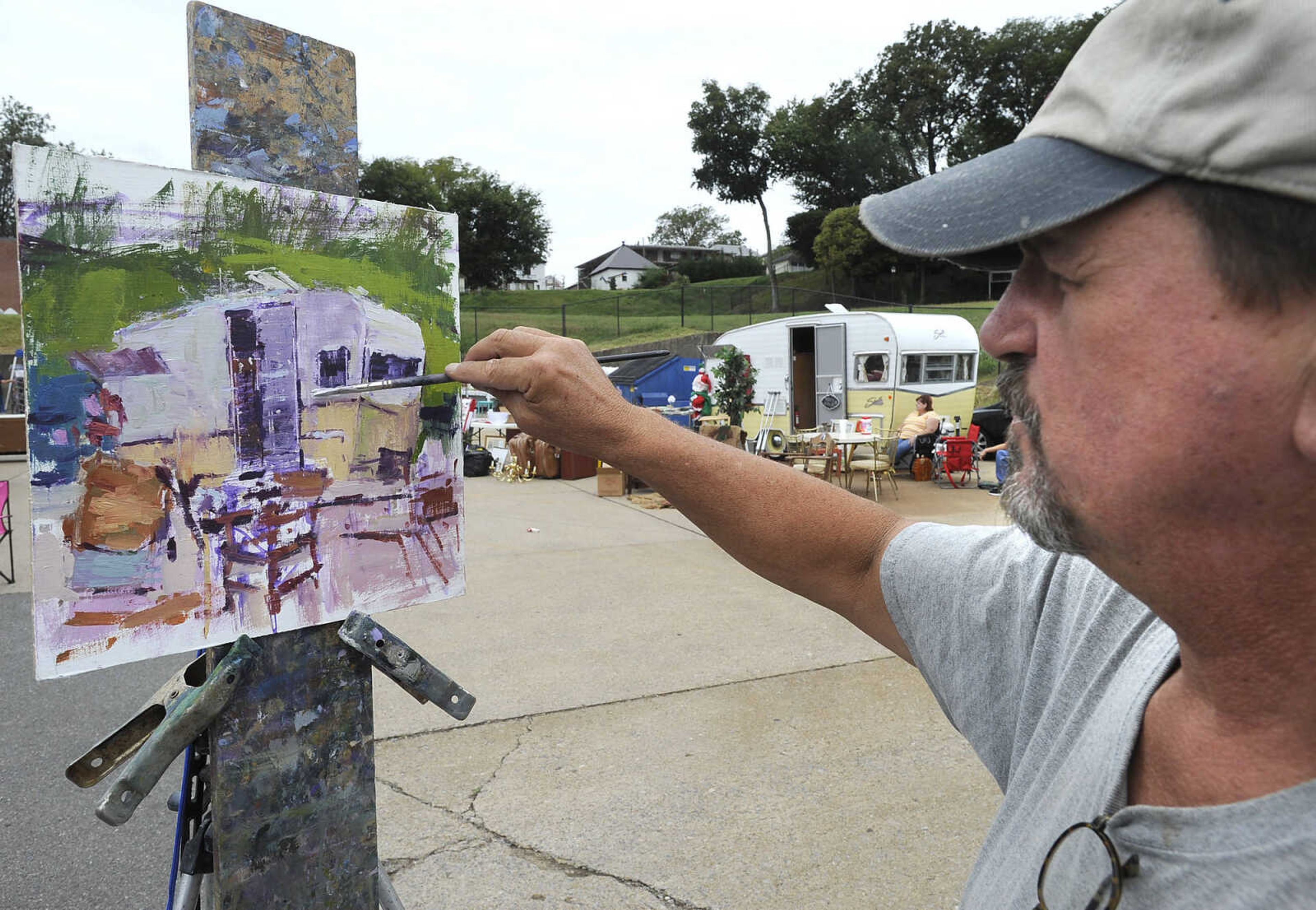 FRED LYNCH ~ flynch@semissourian.com
Lon Brauer works on a plein-air painting of a nearby camper trailer Sunday, Oct. 2, 2016 at the Tailgate Flea Market in downtown Cape Girardeau.