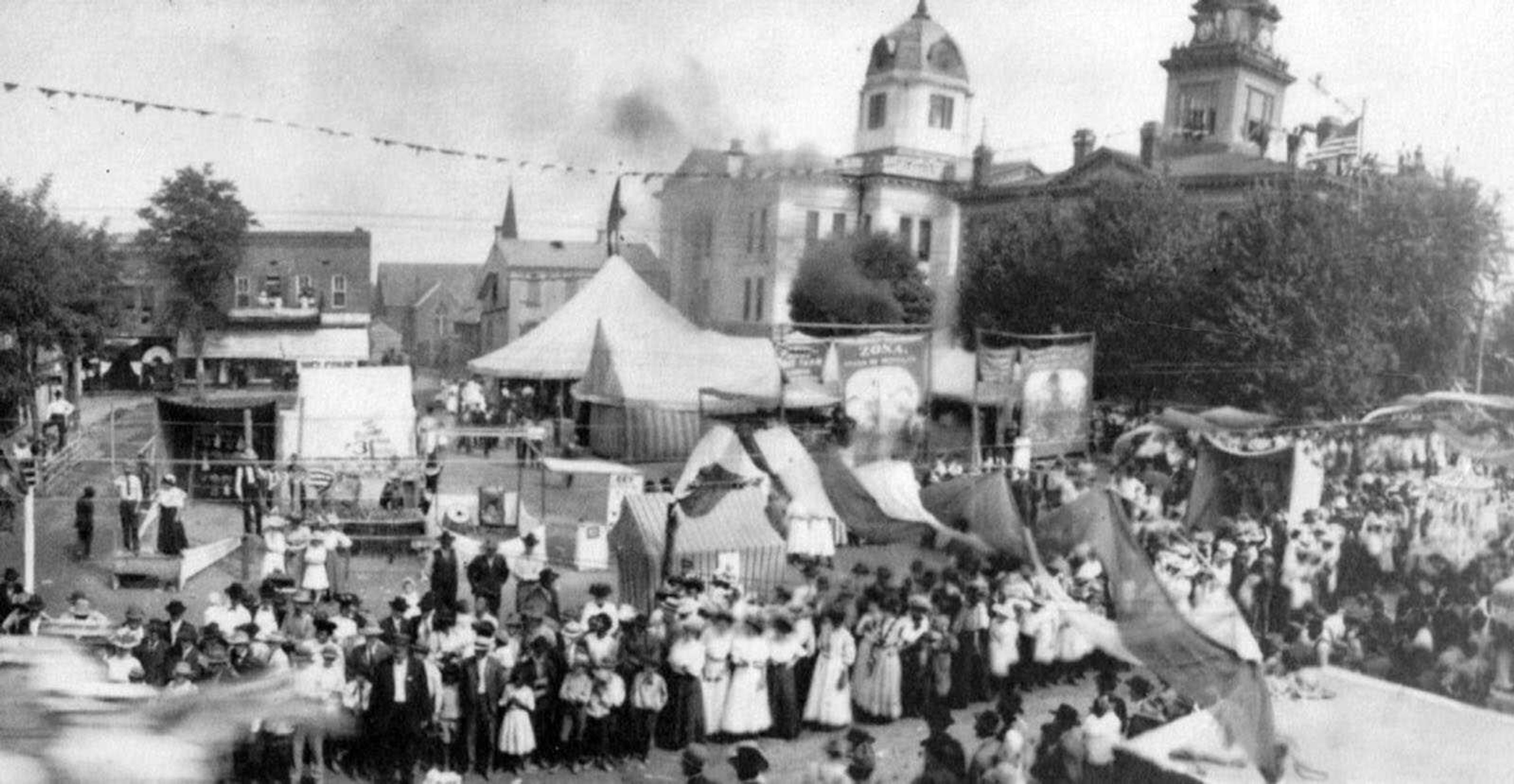 This detail of a 1908 photo of Uptown Jackson taken at the first Homecomers celebration shows the 1908 courthouse and the "old courthouse at right, and the old jail to the immediate left (two-story building behind a white tent). The Jones Drug Store building, center, faces south in this image. It was later rotated to face east to make room for what is now Court Street. (Courtesy of the Jackson Heritage Association)