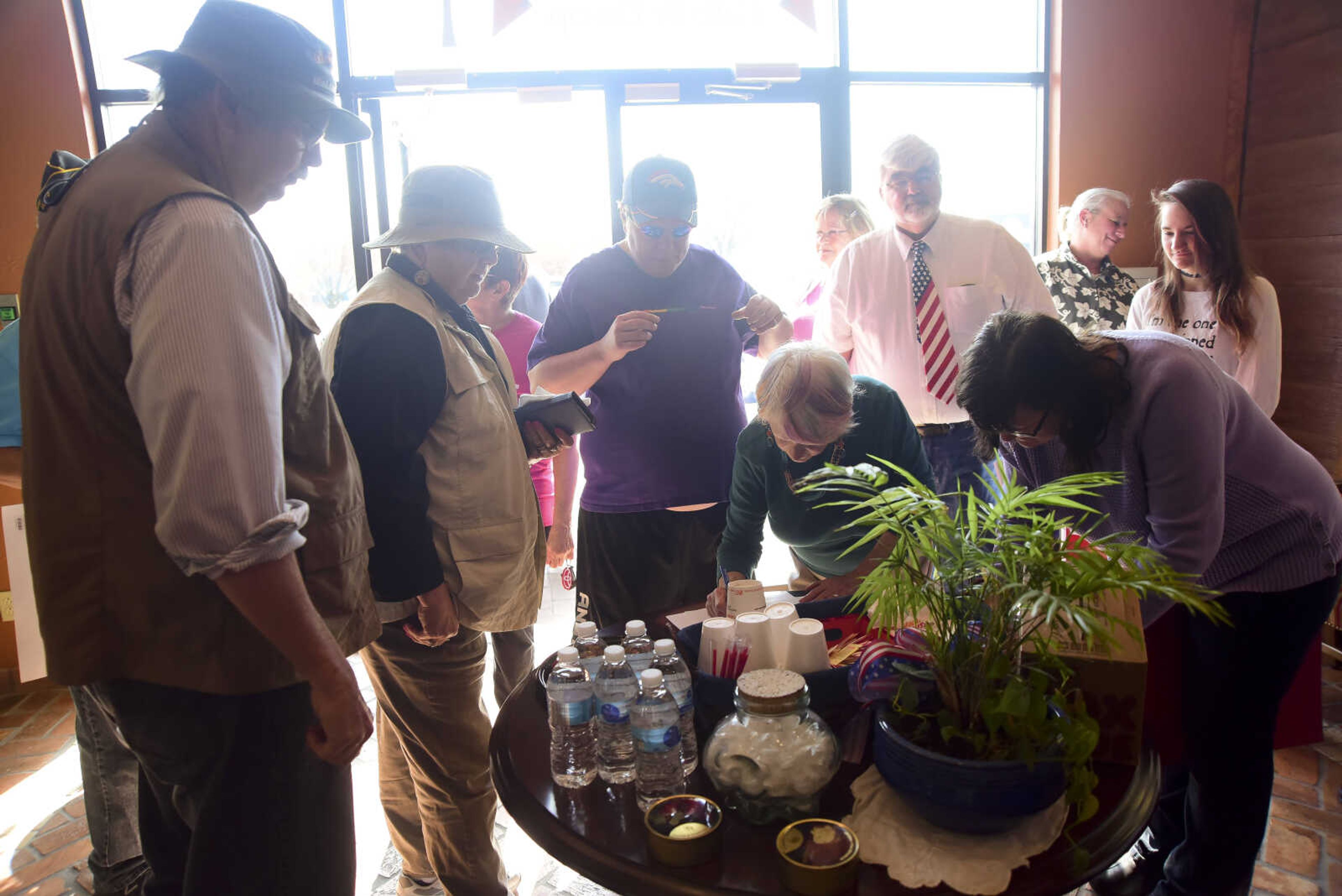 Demonstrators sign in before they bring up concerns they have with District Director, Darren Lingle, for Senator Roy Blunt in U.S. Sen. Roy Blunt's office Wednesday, Feb. 22, 2017 in Cape Girardeau.