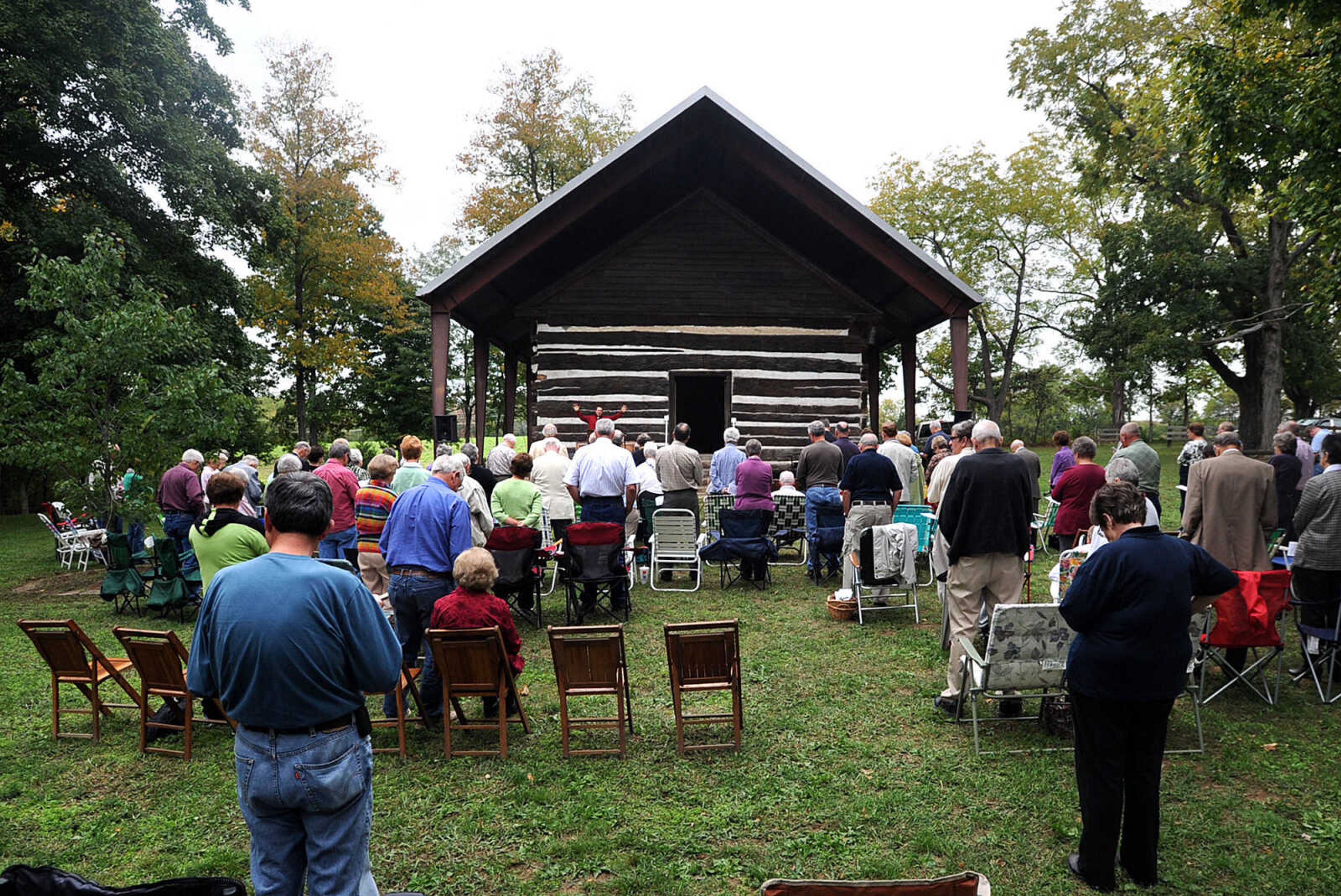 LAURA SIMON ~ lsimon@semissourian.com
People listen as Rev. Michael Schriener of Morning Star Church gives his message to around 100 people Sunday, Sept. 30, 2012 during the annual pilgrimage worship gathering at Old McKendree Chapel in Jackson, Mo. The chapel was built in 1819 and is known as the oldest Protestant church standing west of the Mississippi River.