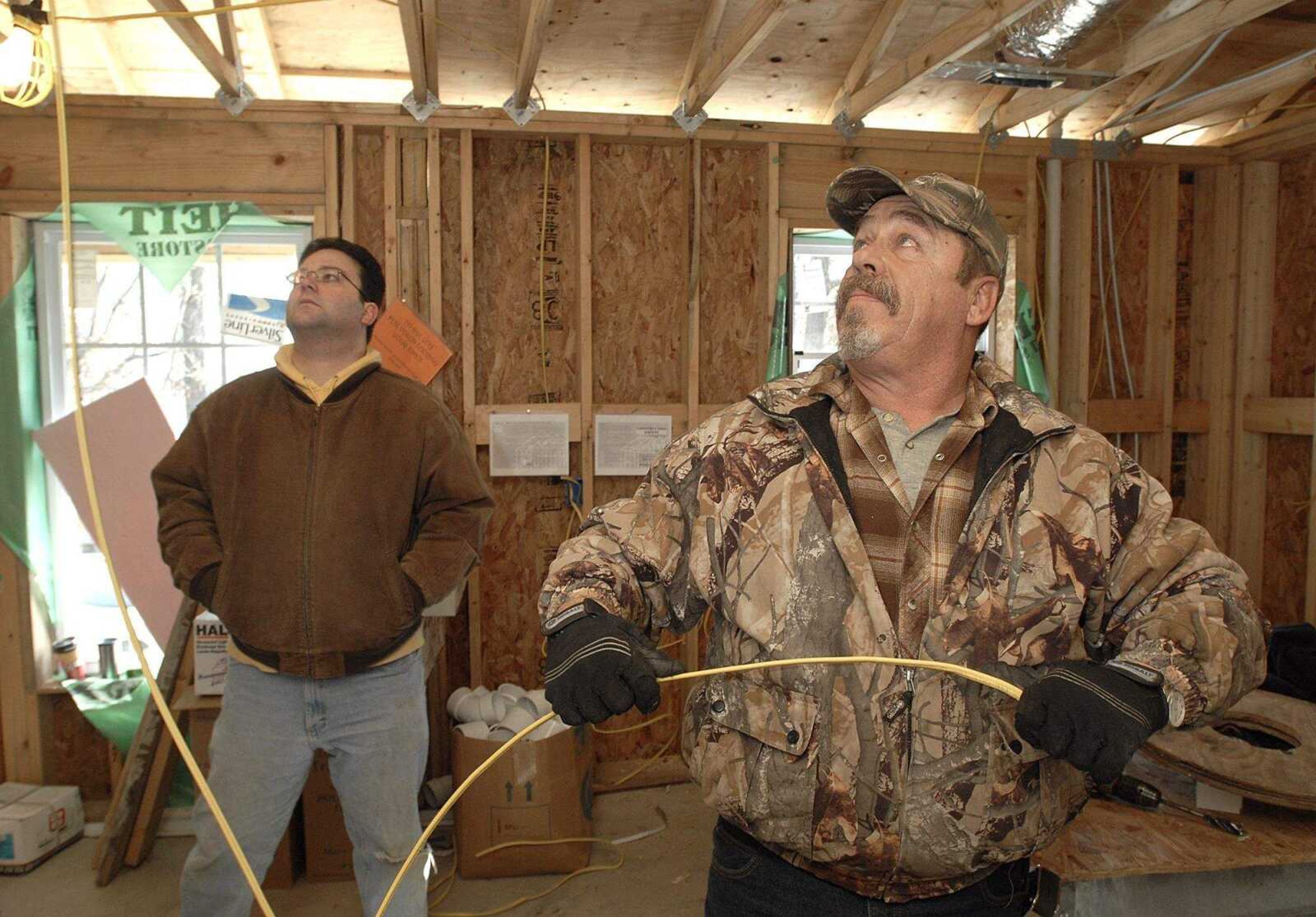 FRED LYNCH ~ flynch@semissourian.com
Johnnie Robins, right, and Charles DiStefano work in a Habitat for Humanity house Saturday in Cape Girardeau.