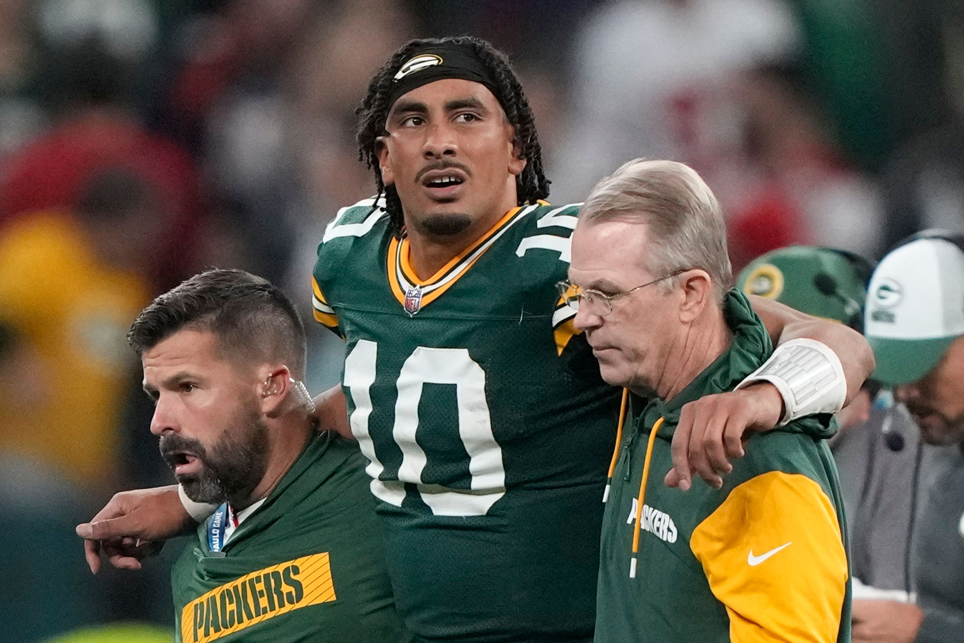 Green Bay Packers quarterback Jordan Love (10) in helped off the field after getting hurt during the second half of an NFL football game against the Philadelphia Eagles, Saturday, Sept. 7, 2024, at the Neo Quimica Arena in Sao Paulo. (AP Photo/Doug Benc)