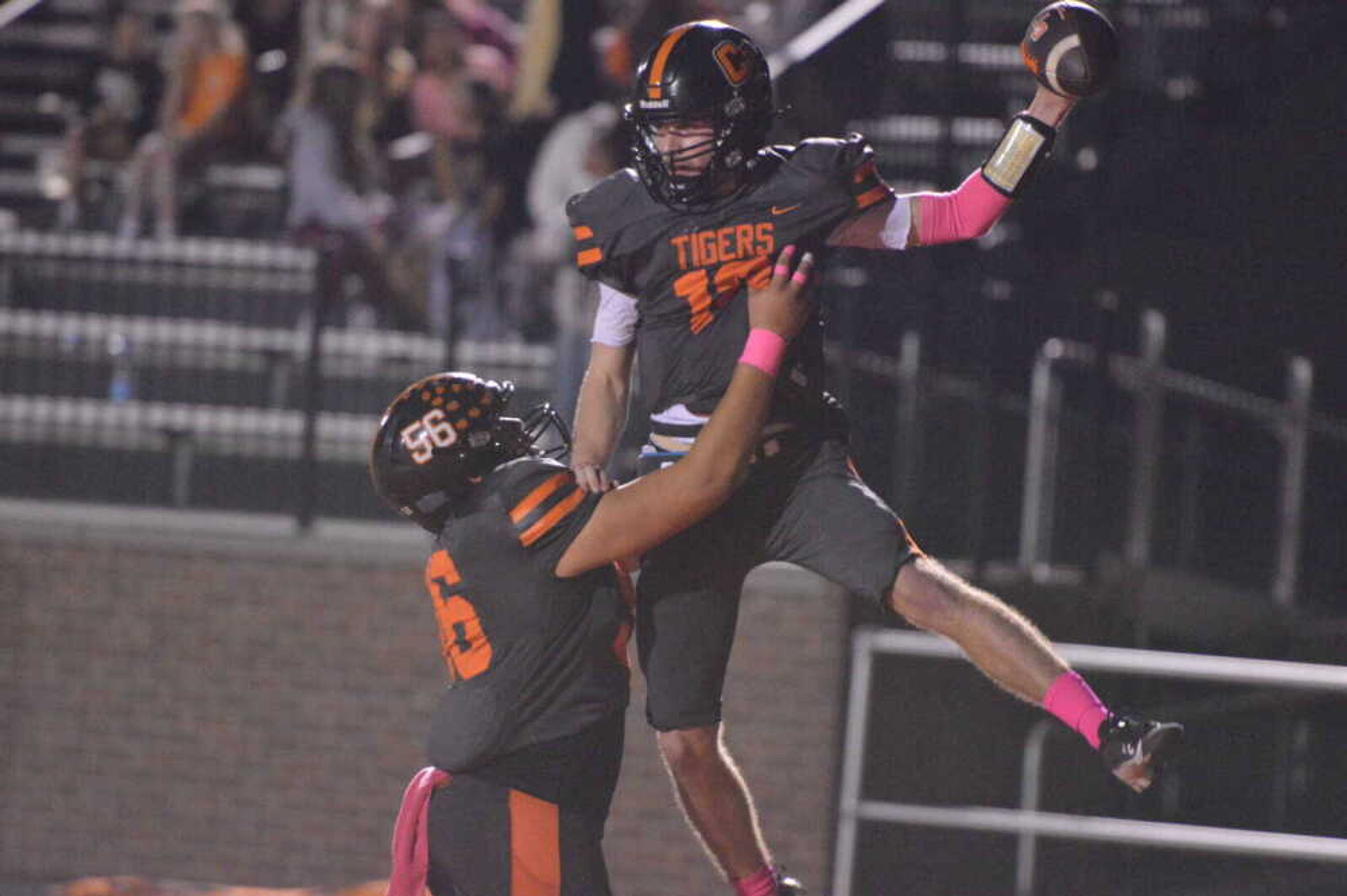 Cape Central quarterback Deklin Pittman celebrates with offensive lineman Isaiah Huskey following a touchdown against Kennett on Friday, Oct. 25, at Tigers Stadium in Cape Girardeau. Deklin and his twin brother Gavin are two of 23 Tiger seniors entering the final postseason of their high school football careers.