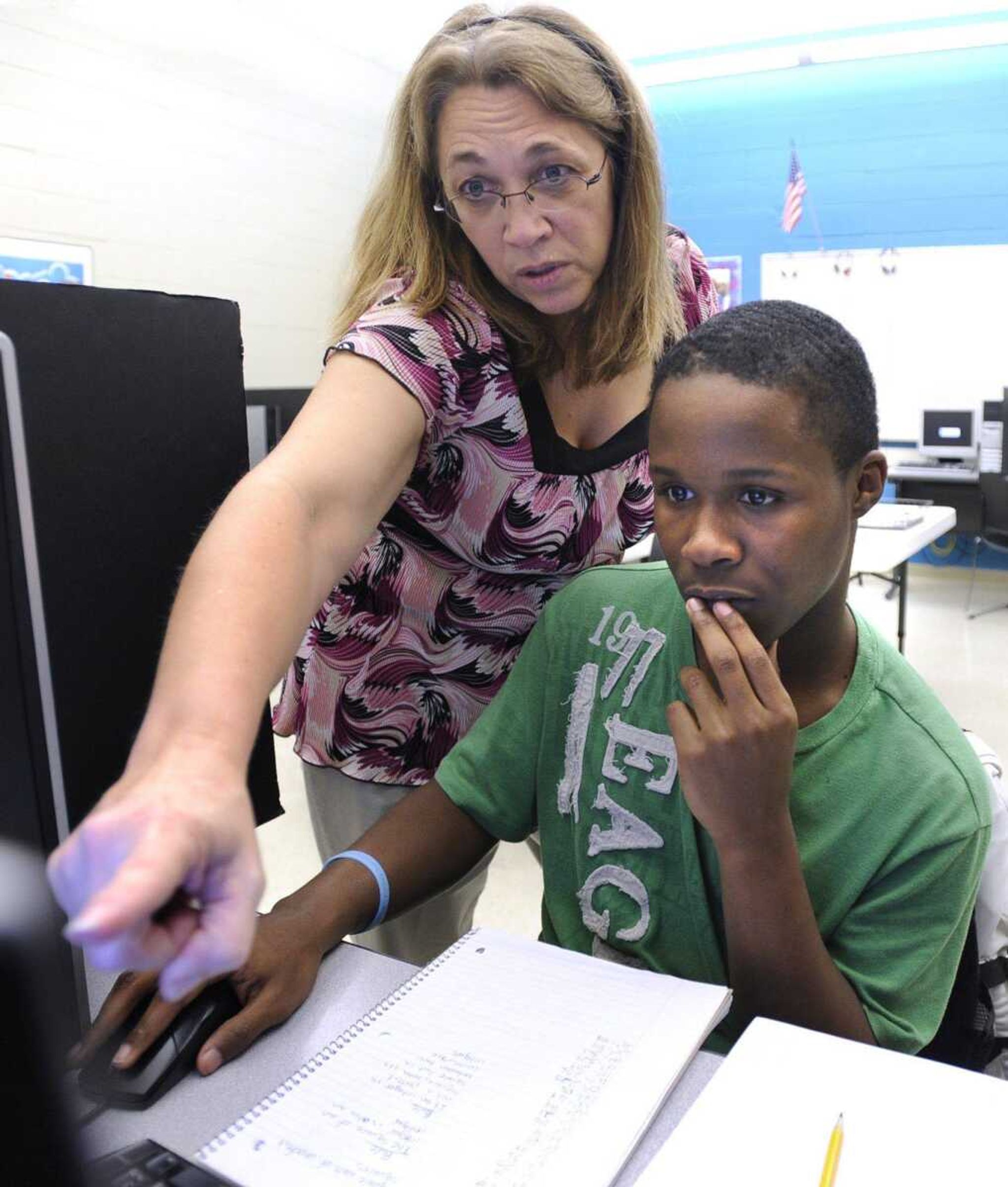 Tremaine Grant, a 10th-grade student at Central High School, and Mary LeGrand, credit recovery program director, discuss an algebra lesson Thursday at the Cape Alternative Education Center.