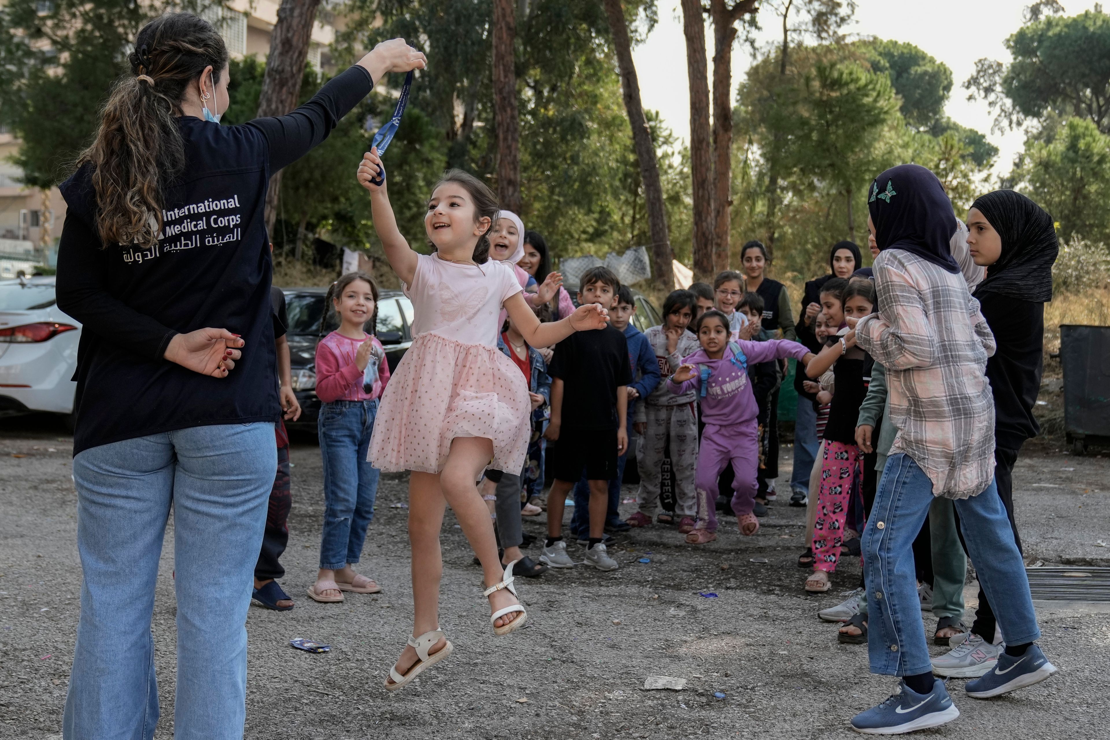 Displaced children take part in activities, organized by the International Medical Corps, at a shelter housing them in Dekwaneh, east Beirut, Lebanon, Thursday, Nov. 7, 2024. (AP Photo/Bilal Hussein)