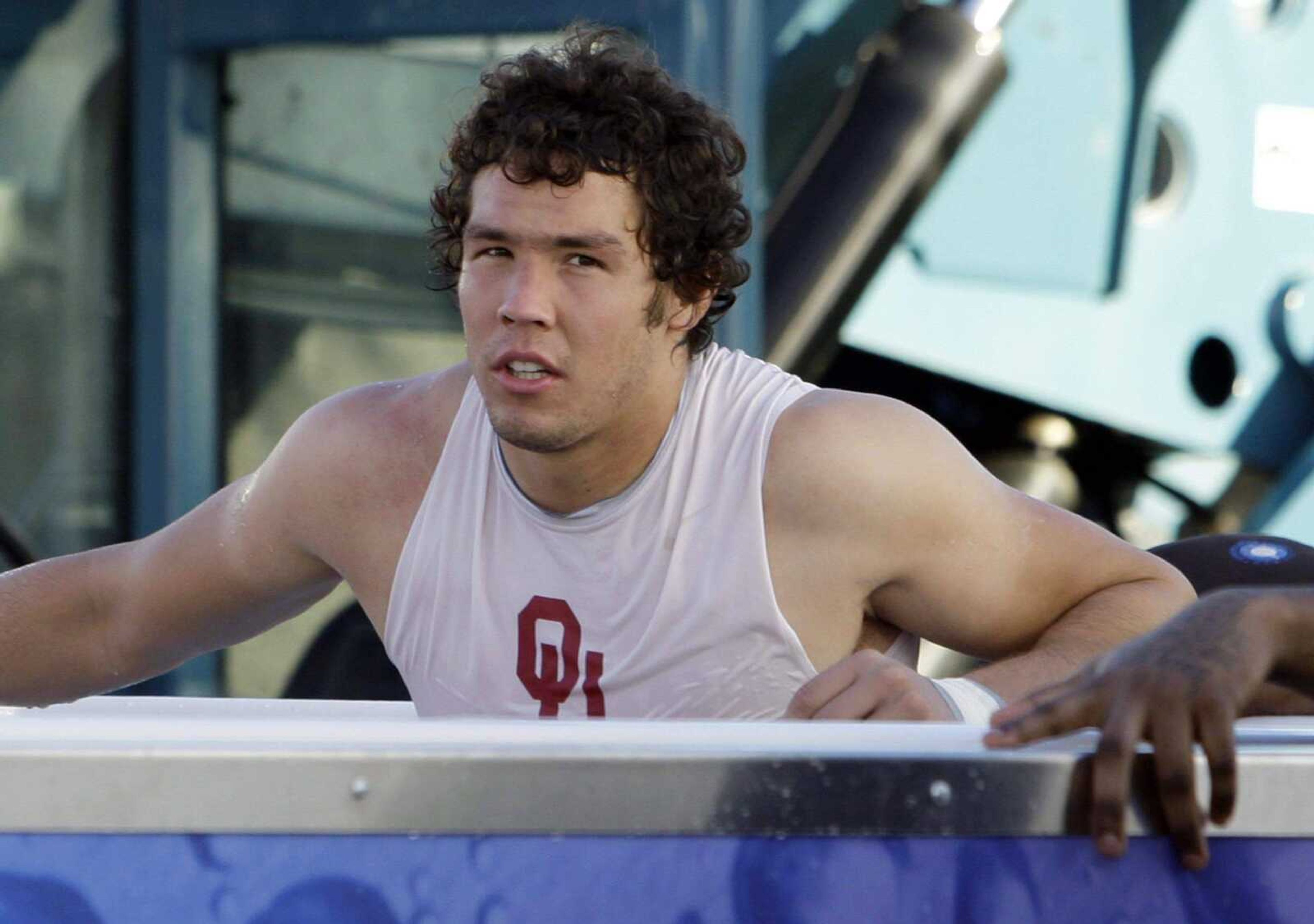 LYNNE SLADKY ~ Associated Press<br>Oklahoma quarterback Sam Bradford, the 2008 Heisman Trophy winner, sits in a hot tub following practice Tuesday at Barry University in Miami Shores, Fla. The No. 2 Sooners are preparing for Thursday's BCS championship game against No. 1 Florida.