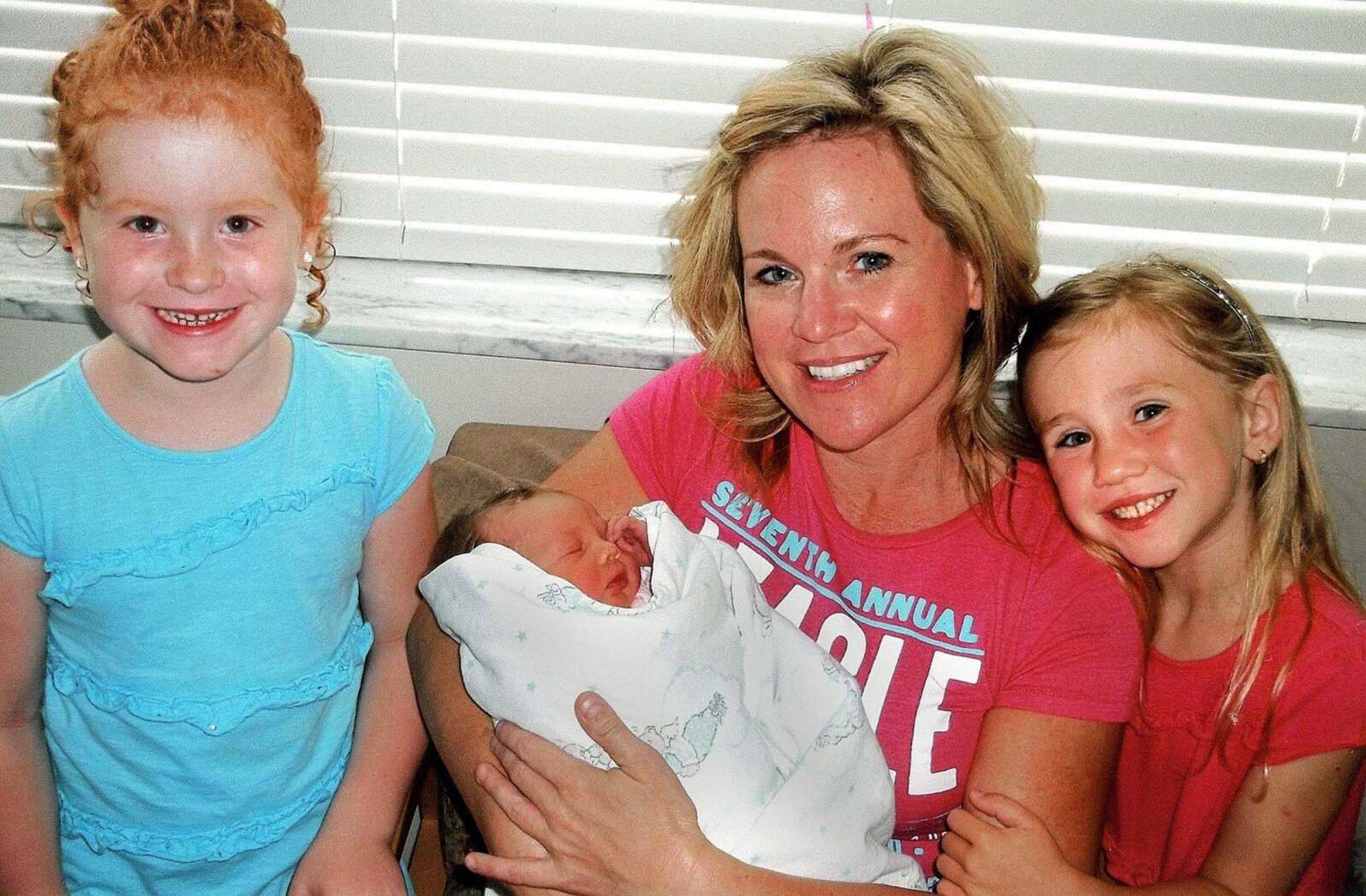 Jacque Waller, pictured with one of her triplets and other family members.
Submitted photo