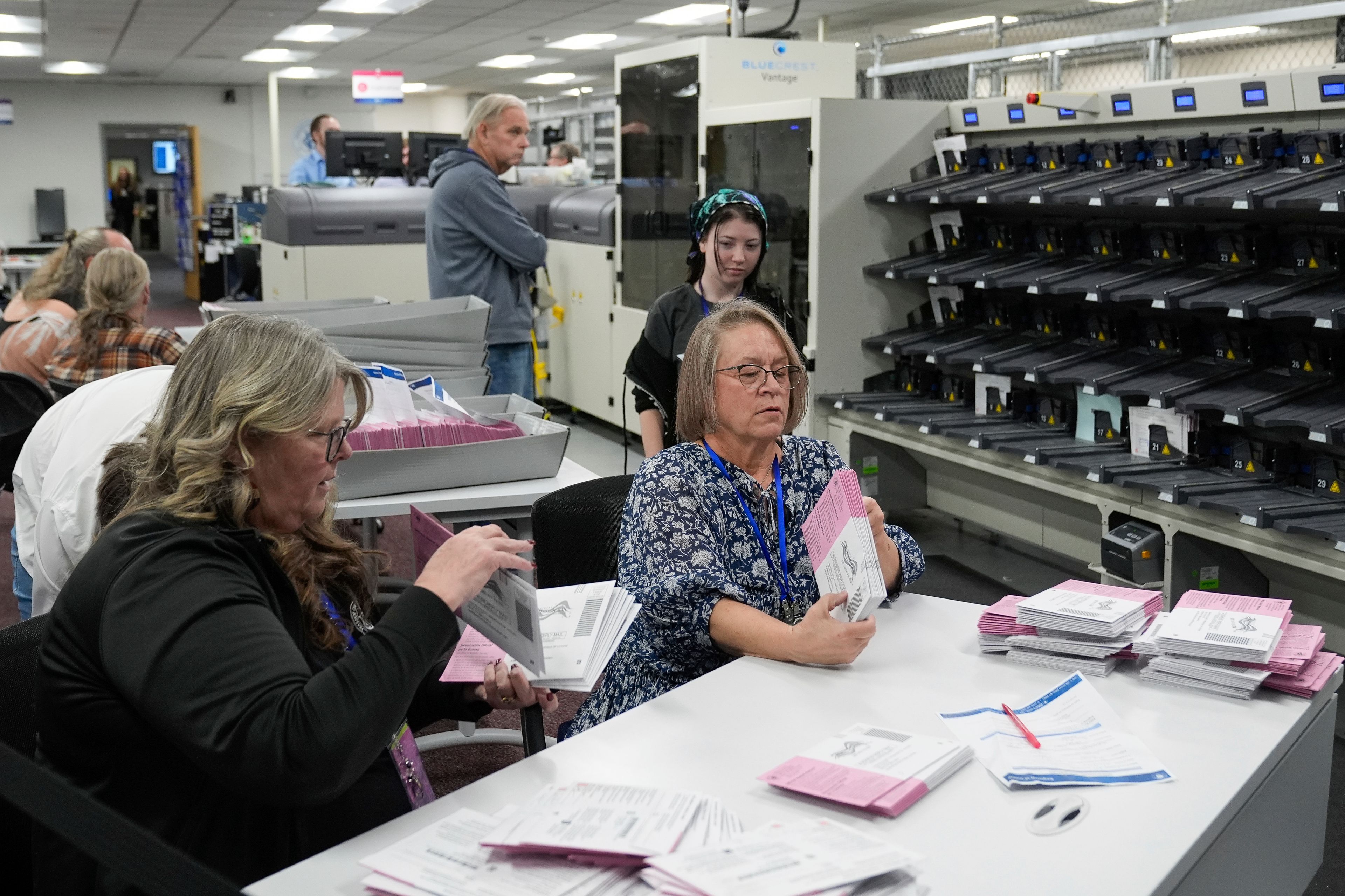 Election workers count ballots at the Washoe County Registrar of Voters Office, Tuesday, Nov. 5, 2024, in Reno, Nev. (AP Photo/Godofredo A. Vásquez)