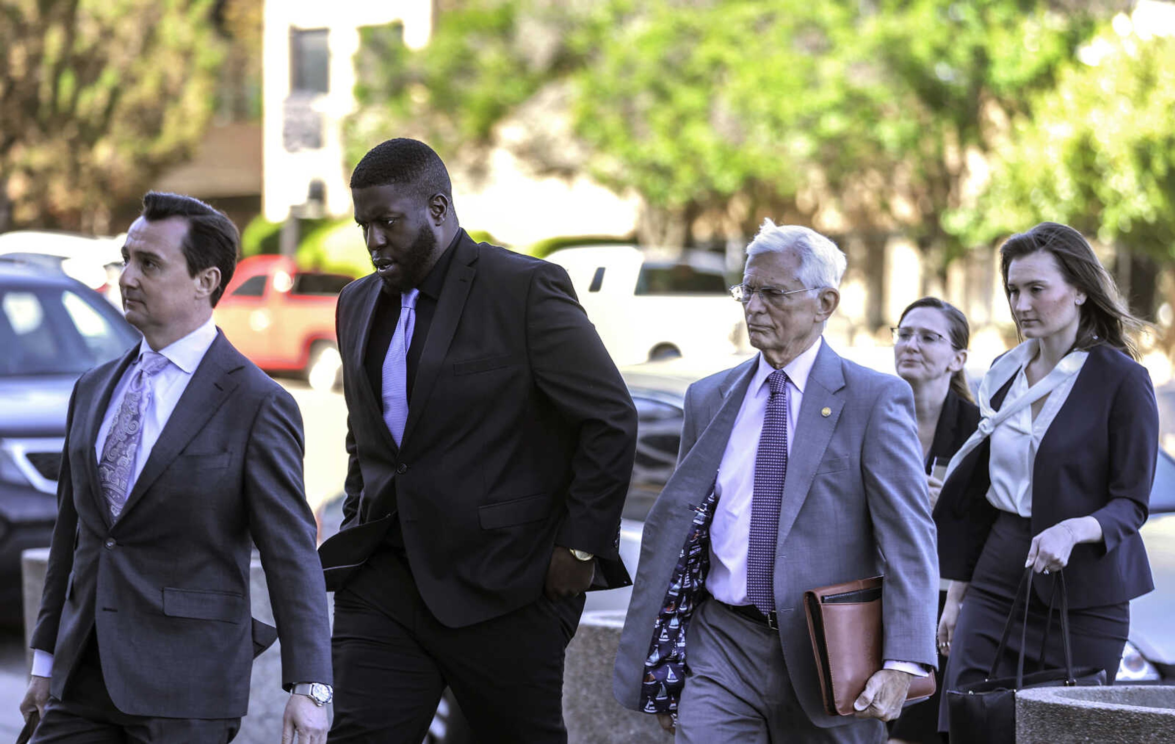 Emmitt Martin III, a former Memphis Police Department officer accused of killing Tyre Nichols last year, walks into federal court with attorney in Memphis, Tenn., on Thursday, April 4, 2024.  The federal trial of four former police officers charged with civil rights violations in the beating death of Tyre Nichols will be held in Memphis, a judge ruled Thursday.(Patrick Lantrip/Daily Memphian via AP)