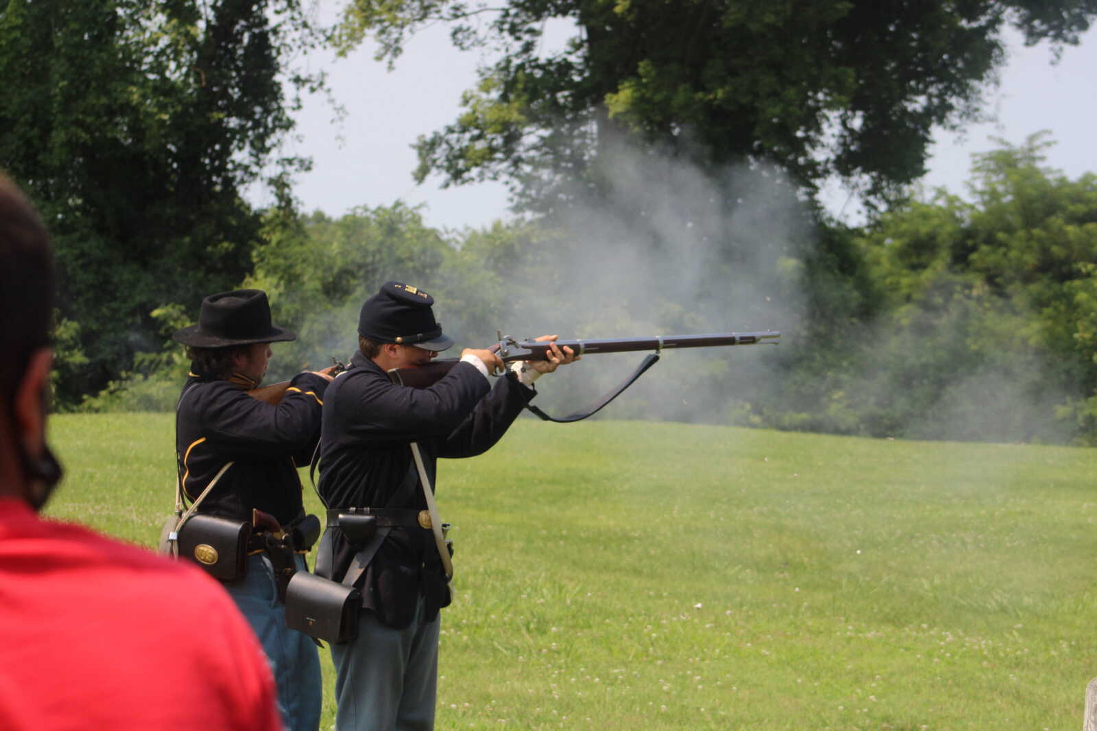 Dalton Blankenship, 15, left, and Andrew Porter, 15, shoot replica rifles for a demonstration at Fort D Historic Site in Cape Girardeau on Sunday, July 4, 2021.