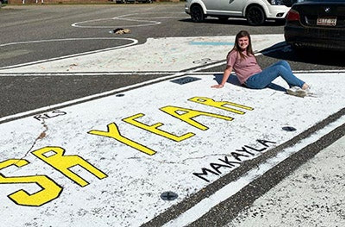 A New Tradition: Red Level seniors brighten campus with painted parkin...