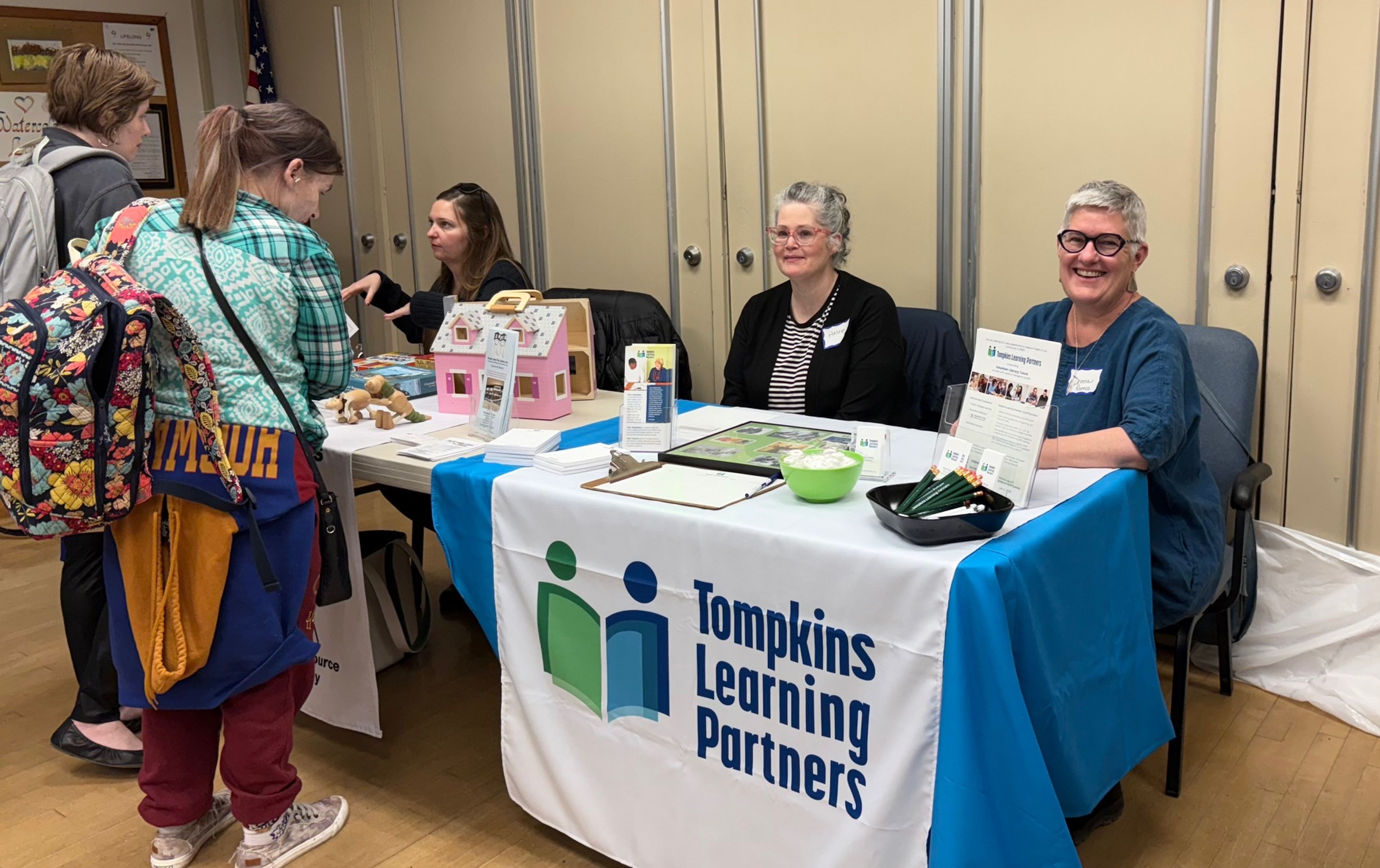 Donna Ramos of Tompkins Learning Partners (far right) meets with potential volunteers at a previous Lifelong Volunteer Fair. This year’s fair is coming up April 28 from 2 to 4 p.m. 