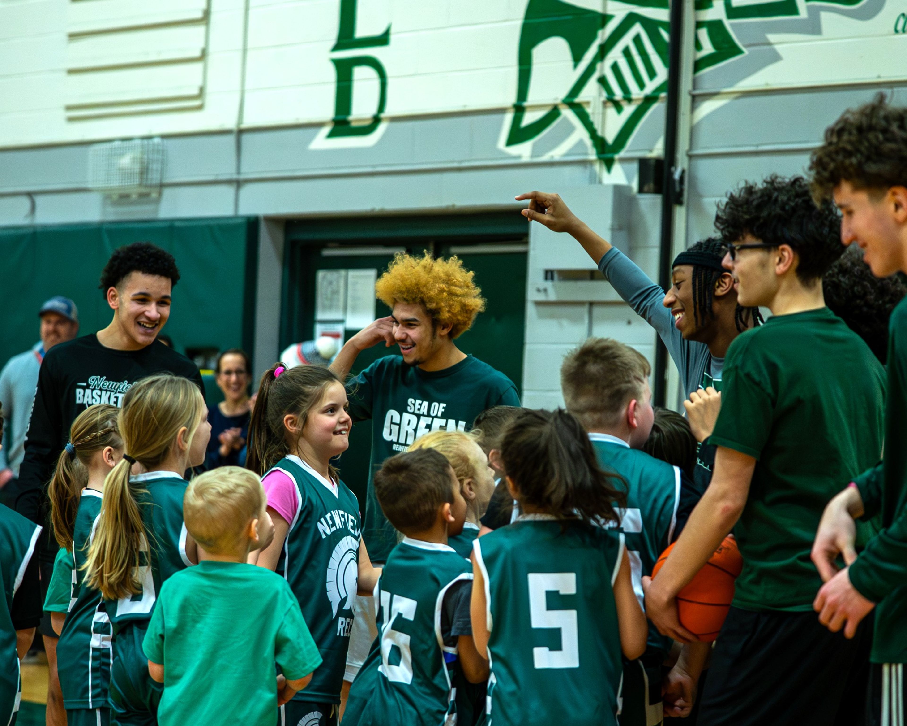Members of the Newfield varsity boys basketball team coach elementary school students who are enrolled in the Newfield Recreation Department’s basketball program. After an exciting winter season, the town’s recreation department is gearing up for its spring sports, including baseball and softball, and summer day camp.  