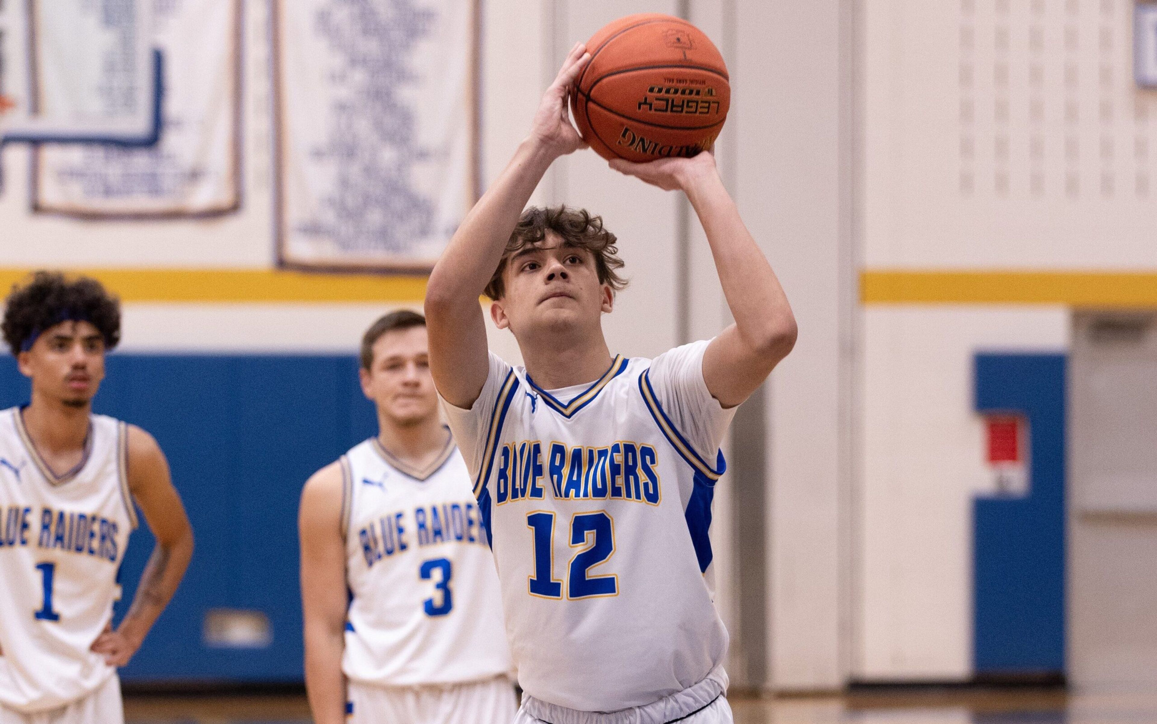 Trumansburg's Mason von Gordon is one of the key returners for the boys basketball team. The junior has helped the Blue Raiders get off to a 2-0 start under first-year head coach Erick Whelpley. Also pictured are Lance Lawton Jr. (#1) and Austin Chaney (#3). Photo by John Brehm