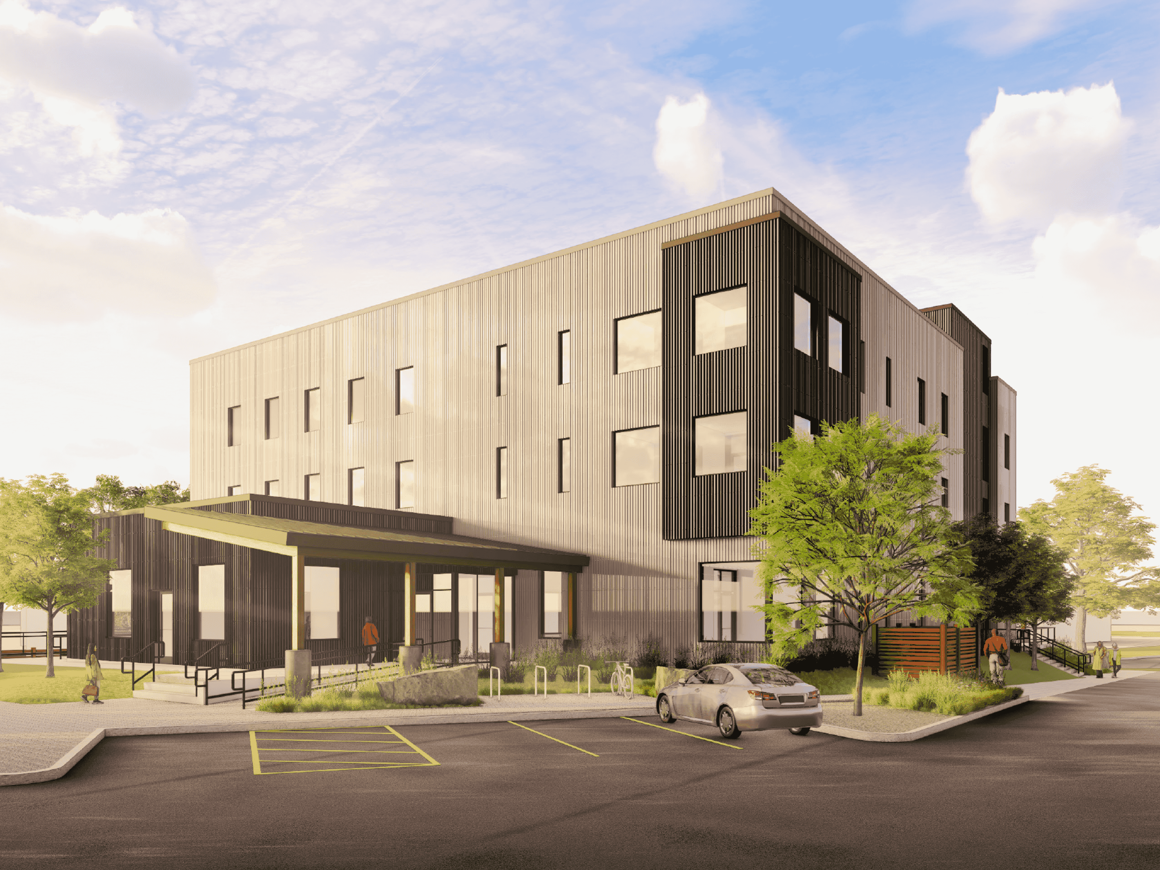 A rendering of the proposed 80-bed homeless shelter on Cherry Street, showing a three-story design elevated above the floodplain with services on the ground floor and residential space above.