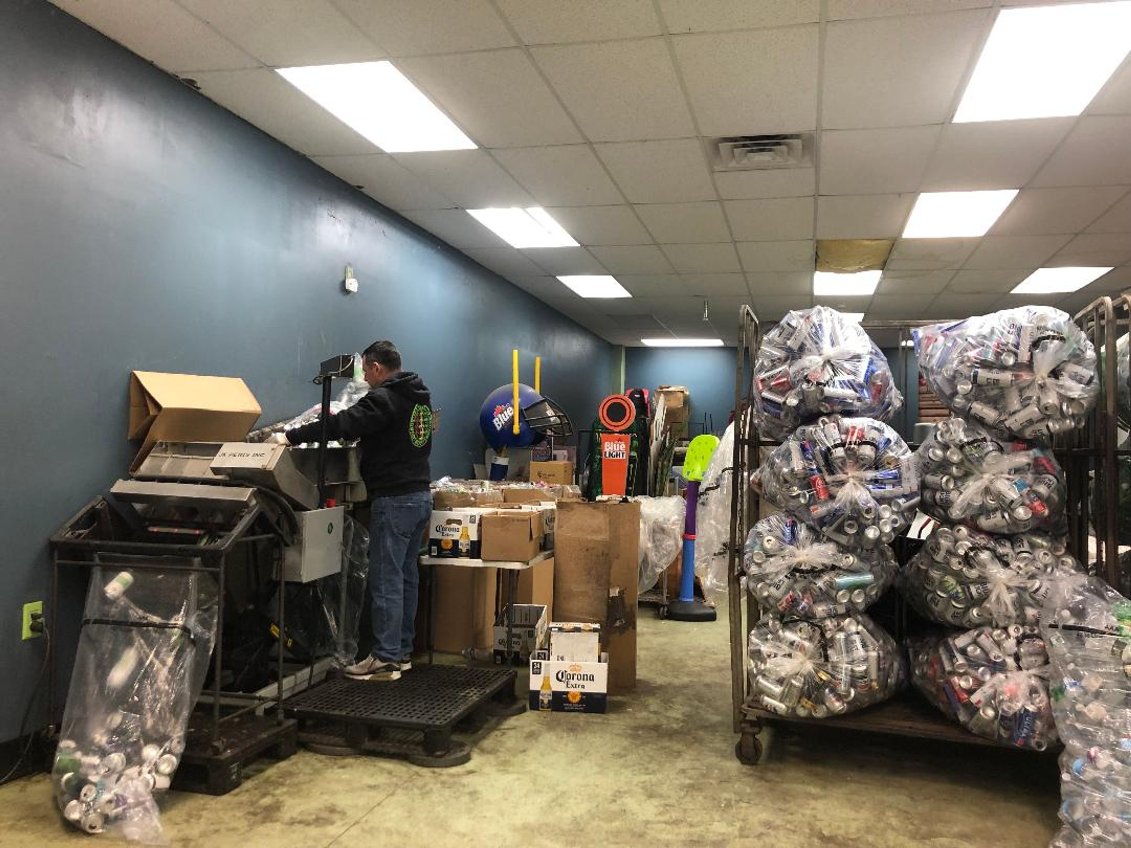 Nick Moe at his counting machine at the Trumansburg Redemption Center.