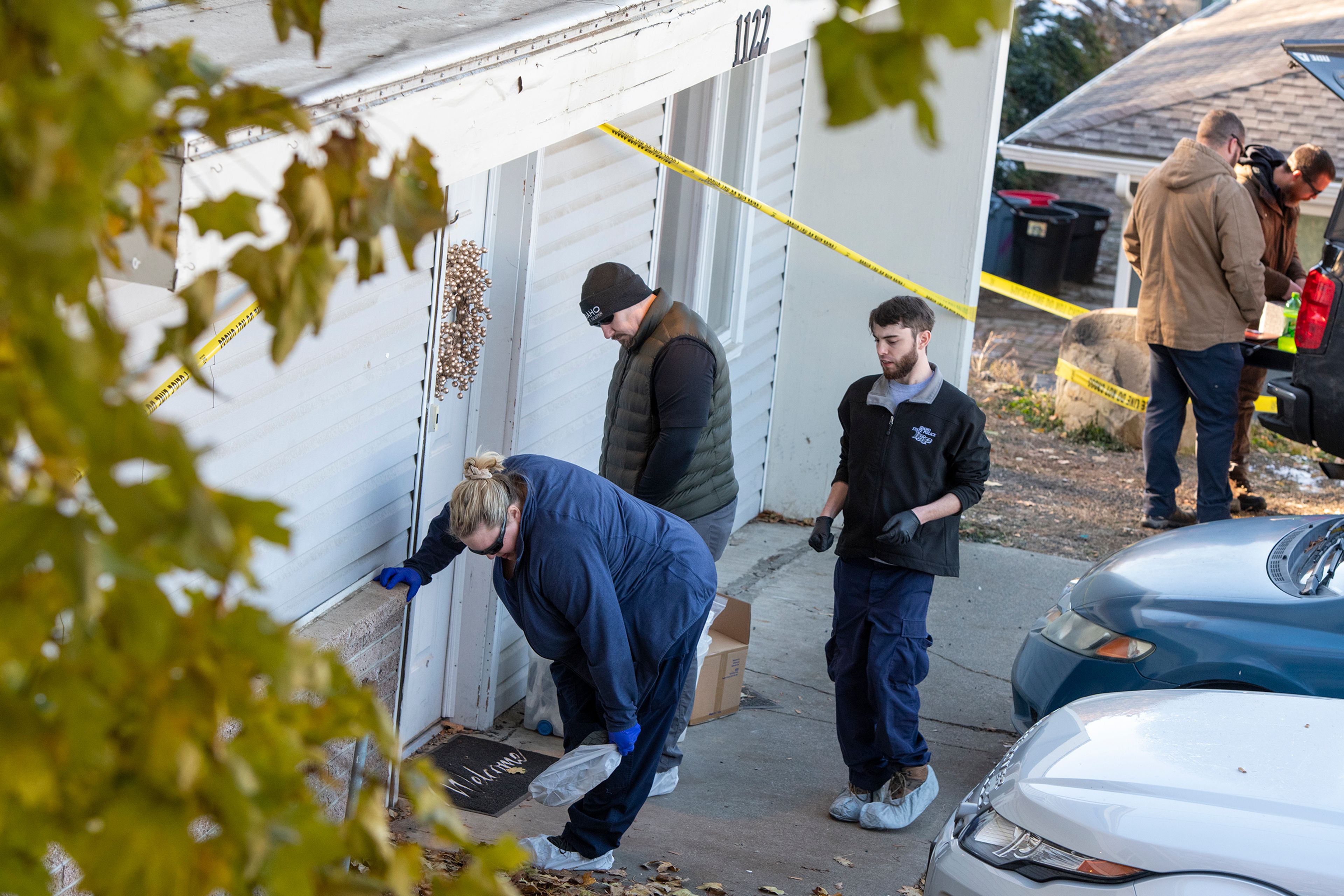 Members of the Idaho State Police forensic team investigate Friday at a home where four University of Idaho students were recently murdered over the weekend in Moscow.