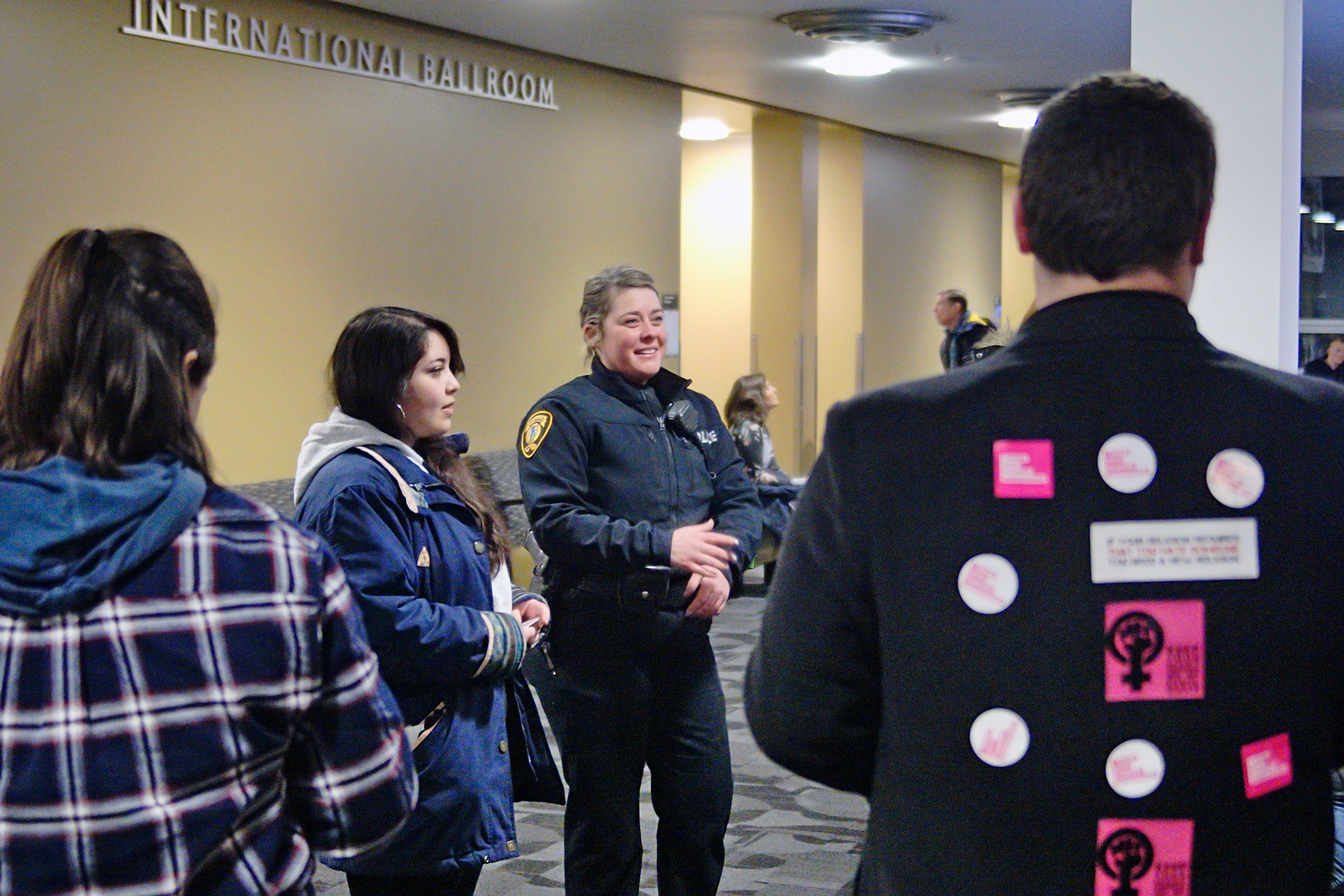 Moscow police officer Meagan Vincello talks to protesters, giving them the ground rules, before a talk by the Rev. Doug Wilson titled "The Lost Virtue of Sexism" on Tuesday in the Bruce Pitman Center at the University of Idaho.