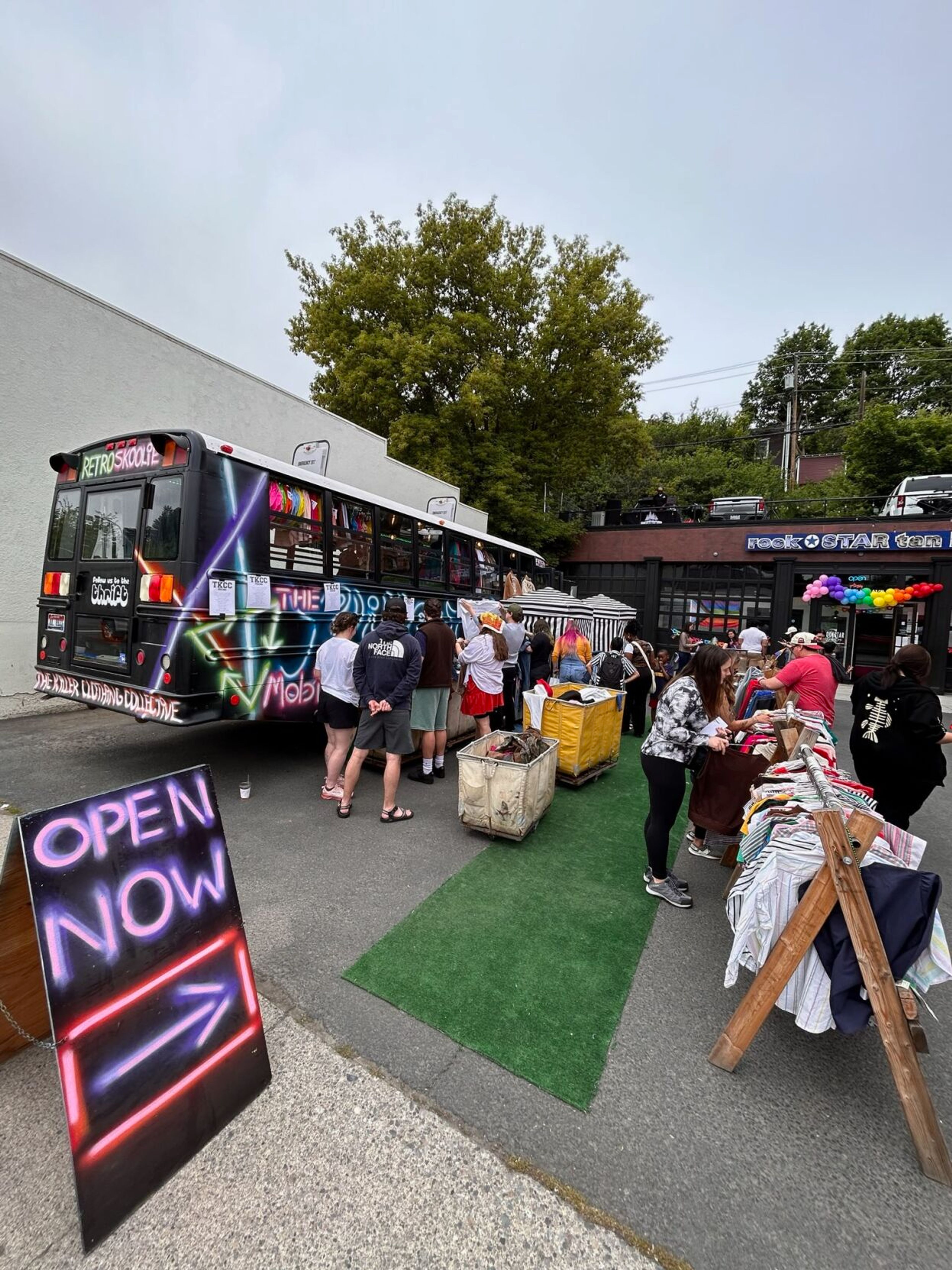 Shoppers browse the selection at a pop-up shop of The Killer Clothing Collective in Pullman.