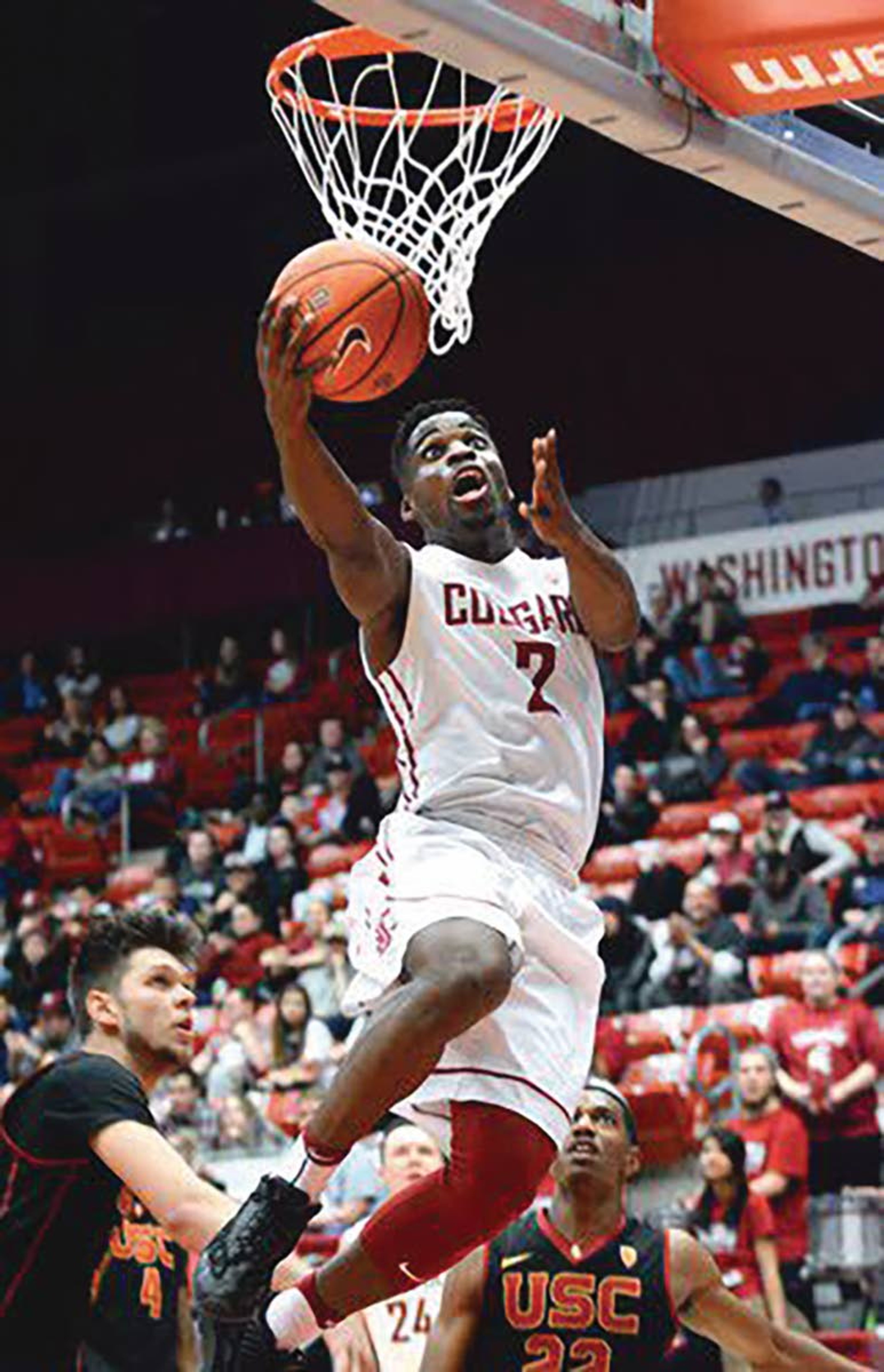 Former Washington State basketball player Ike Iroegbu, with ball, recently was selected to play on the Nigerian Olympic basketball team.