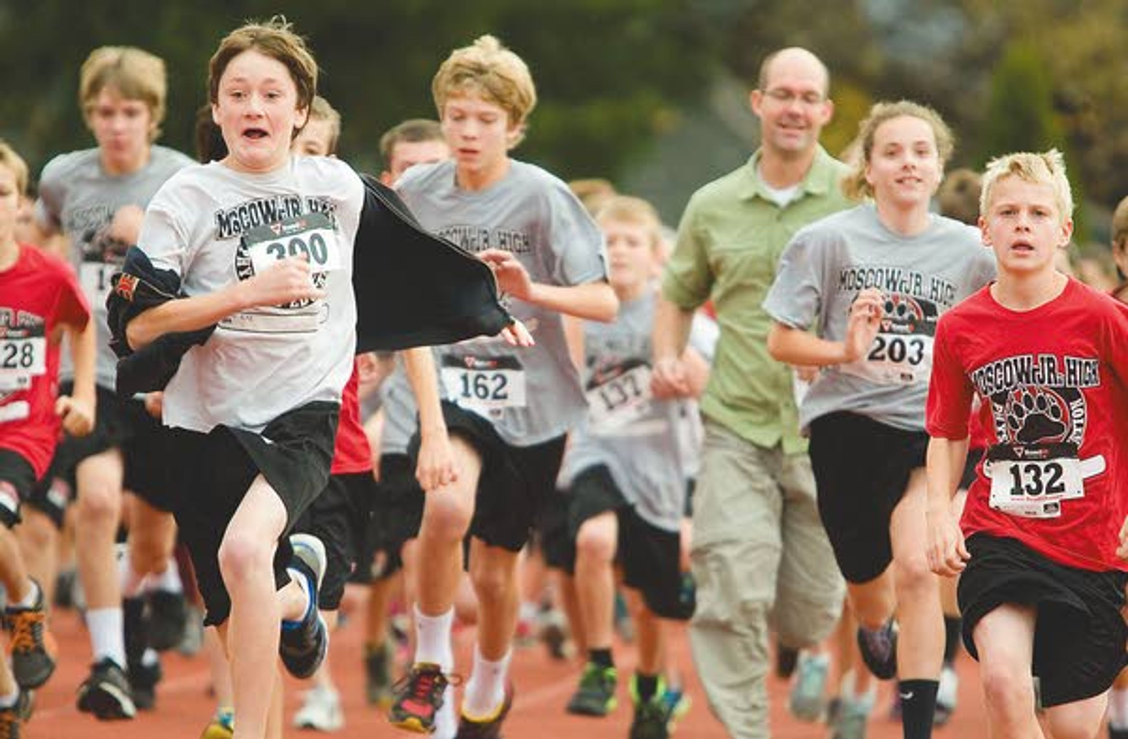 Seventh-graders and their parents run in the second annual fun run at Moscow Middle School on Monday.