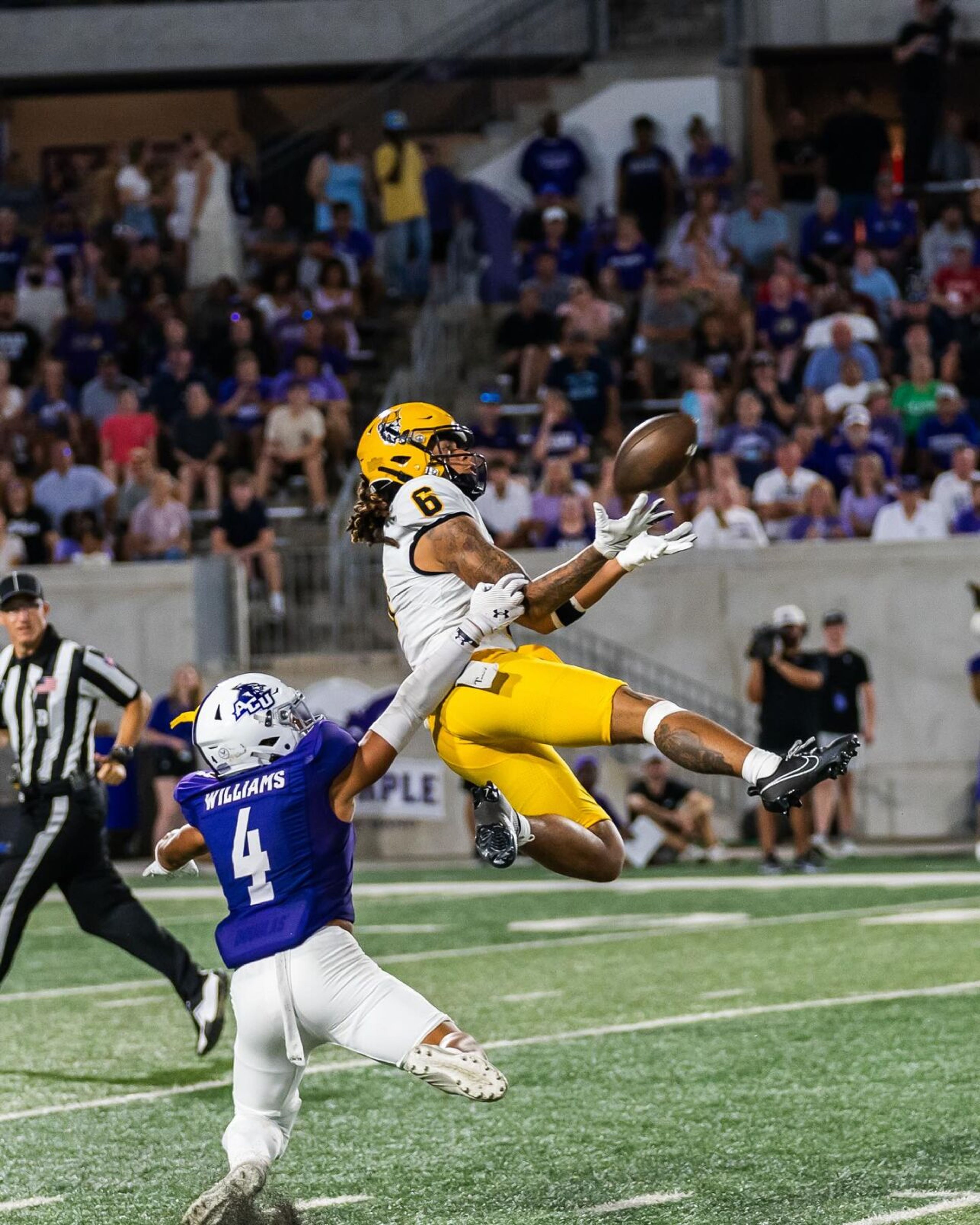 Idaho wide receiver Jordan Dwyer (6) leaps to attempt a catch while Abilene Christian defensive back Tyson Williams defends during a game Saturday in Abilene, Texas.