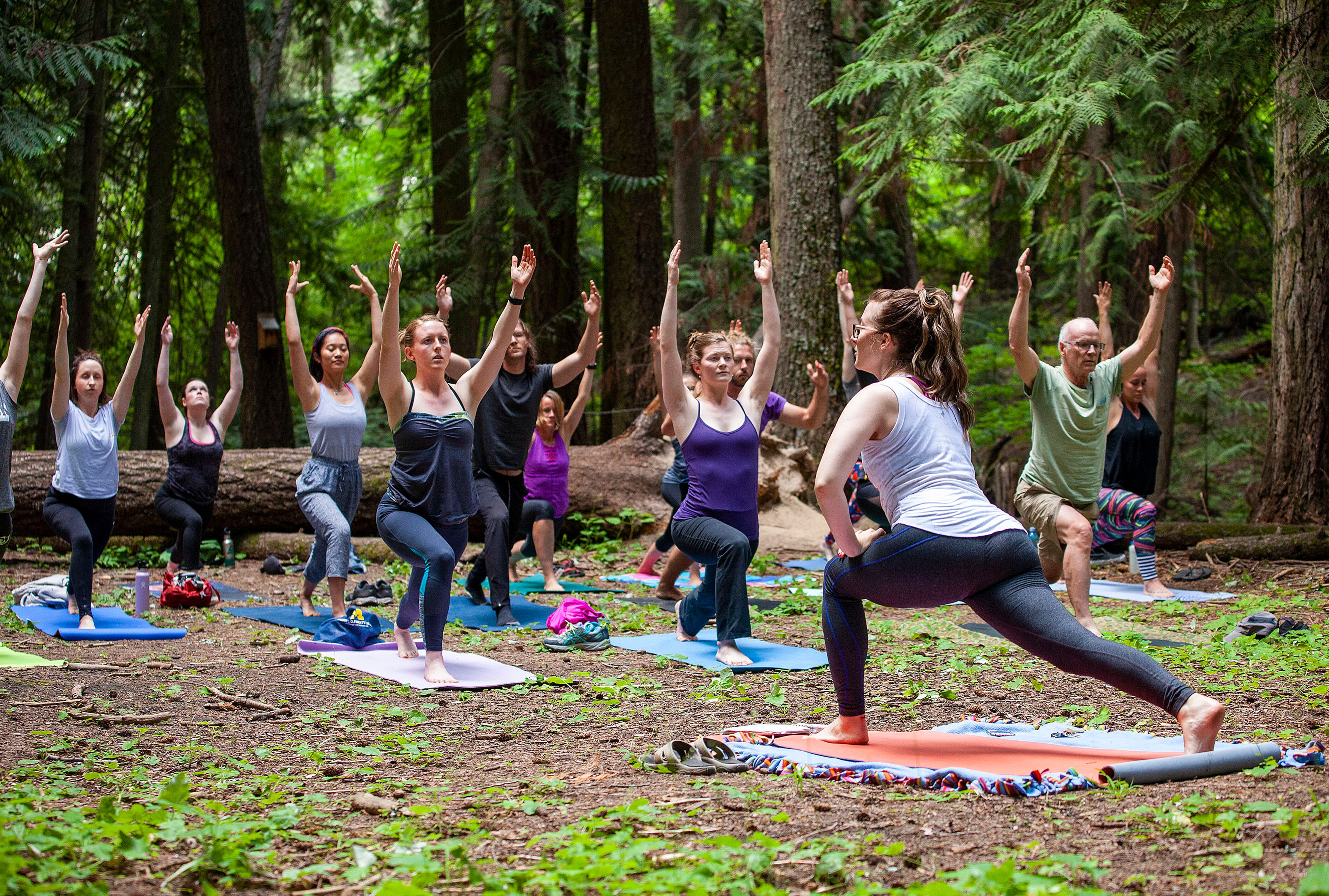 Meggie Cafferty, front, teaches a Yoga In The Cedars class Wednesday at Idler’s Rest Nature Preserve north of Moscow. The yoga classes are organized by the Palouse Land Trust. The next class is scheduled for July 20.