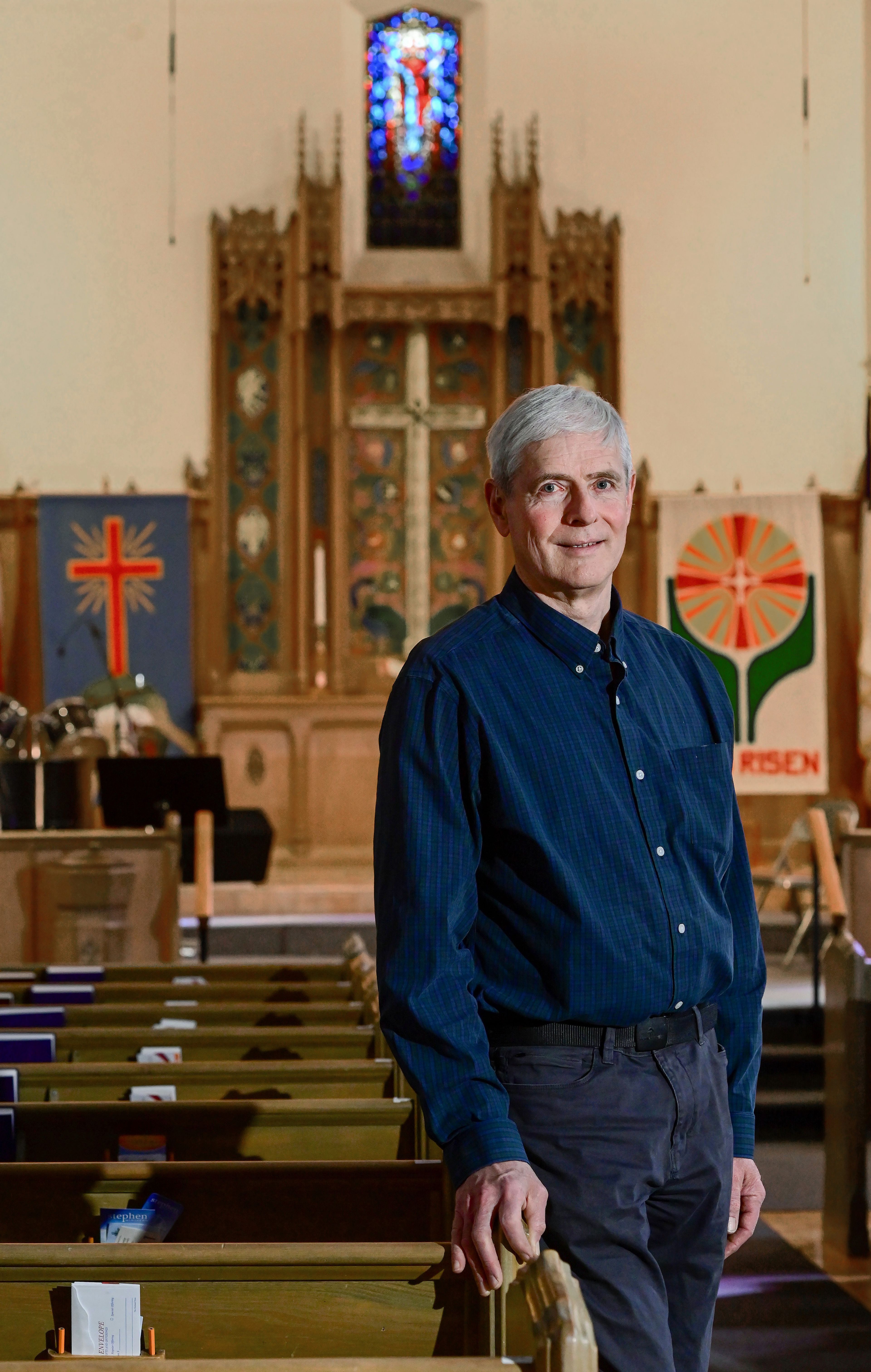 Retiring First Presbyterian Church pastor Norman Fowler stands in the sanctuary of the church in Moscow on Wednesday.