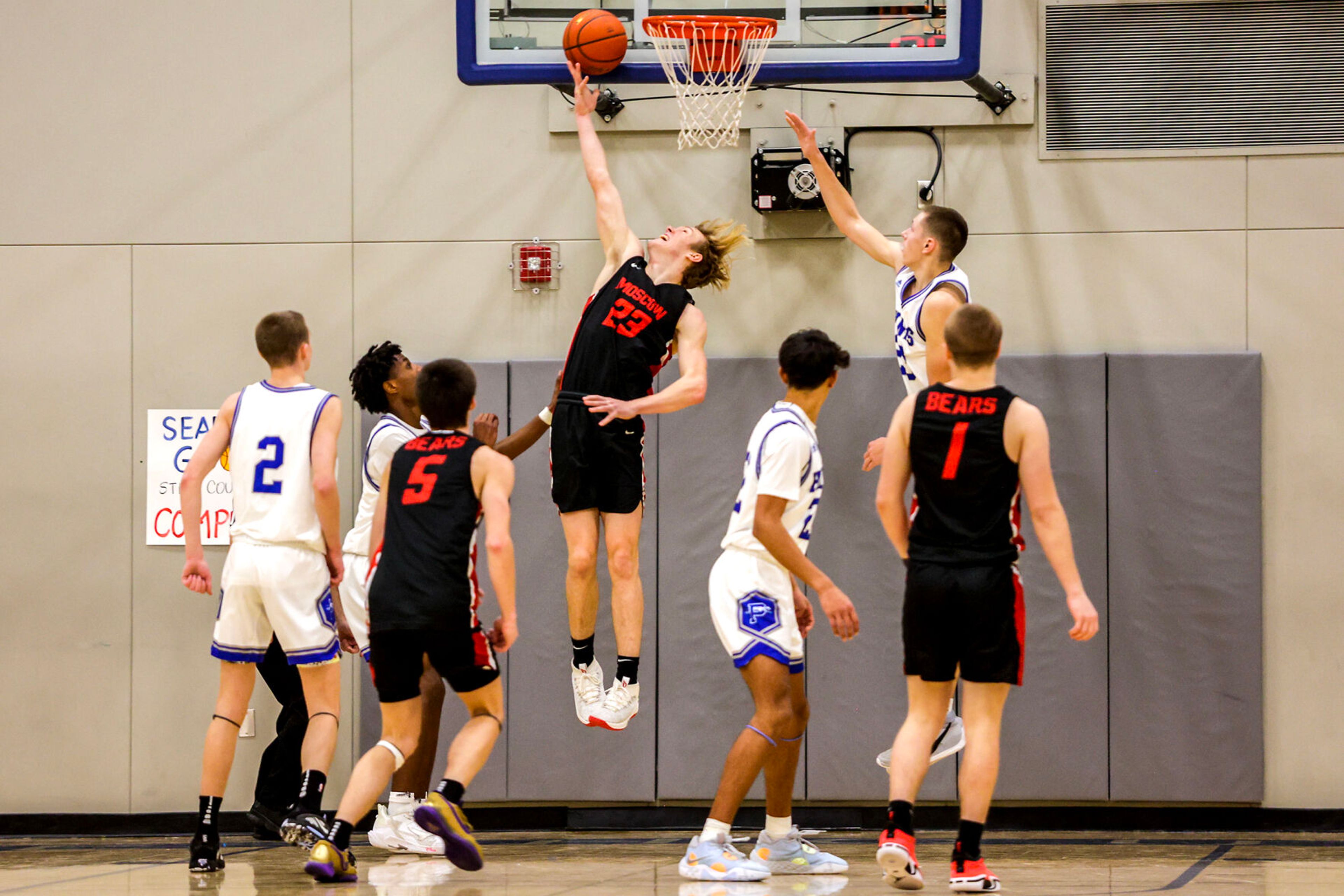 Moscow post Caleb Skinner, center, shoots a layup during Saturday's nonleague boys basketball game at Pullman.