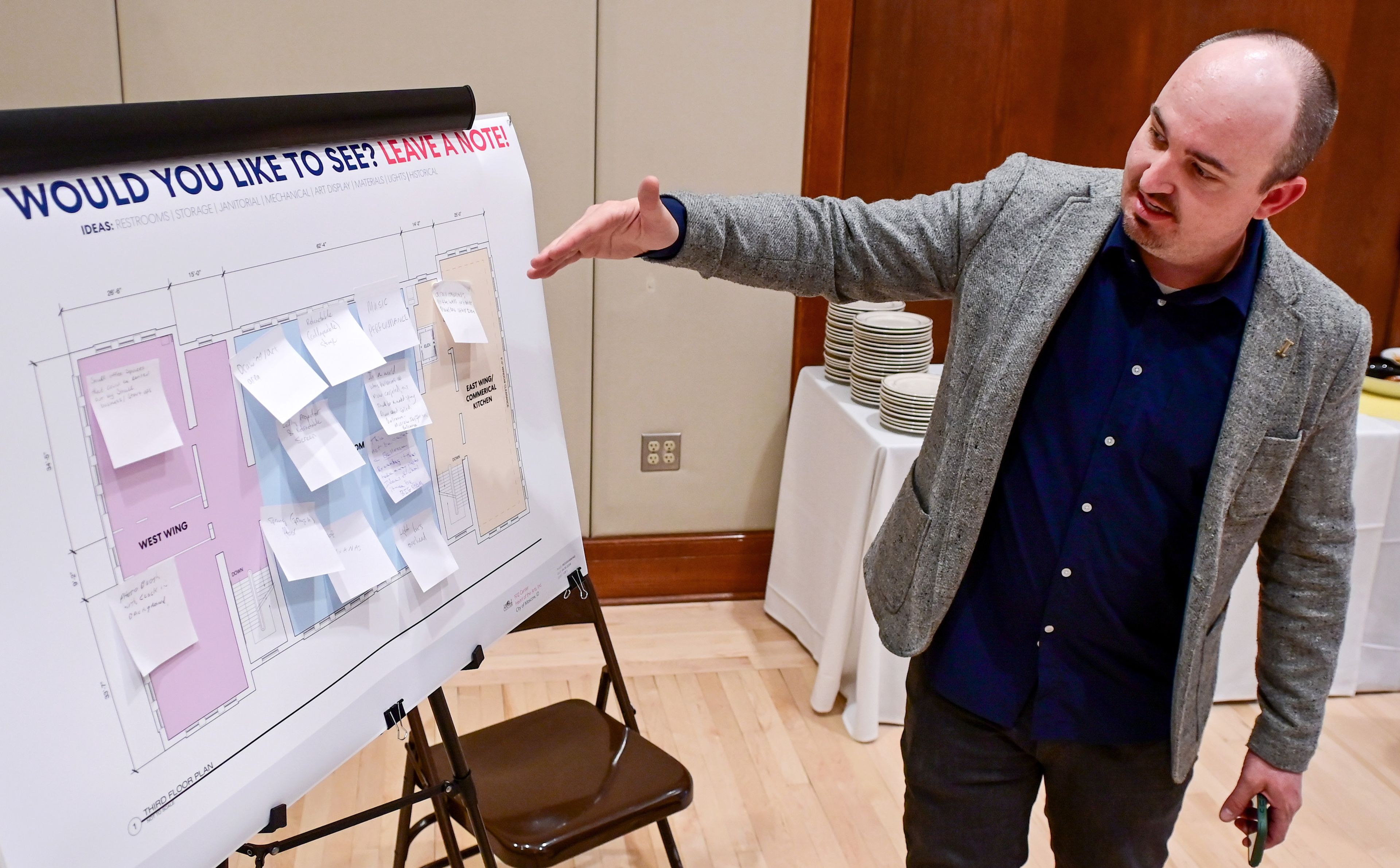 Drew Davis, project manager for Knit and city of Moscow council member, points to a layout of the 1912 Center’s third floor in Moscow on Tuesday. Community members were encouraged to leave notes on the display with ideas for utilizing the space.