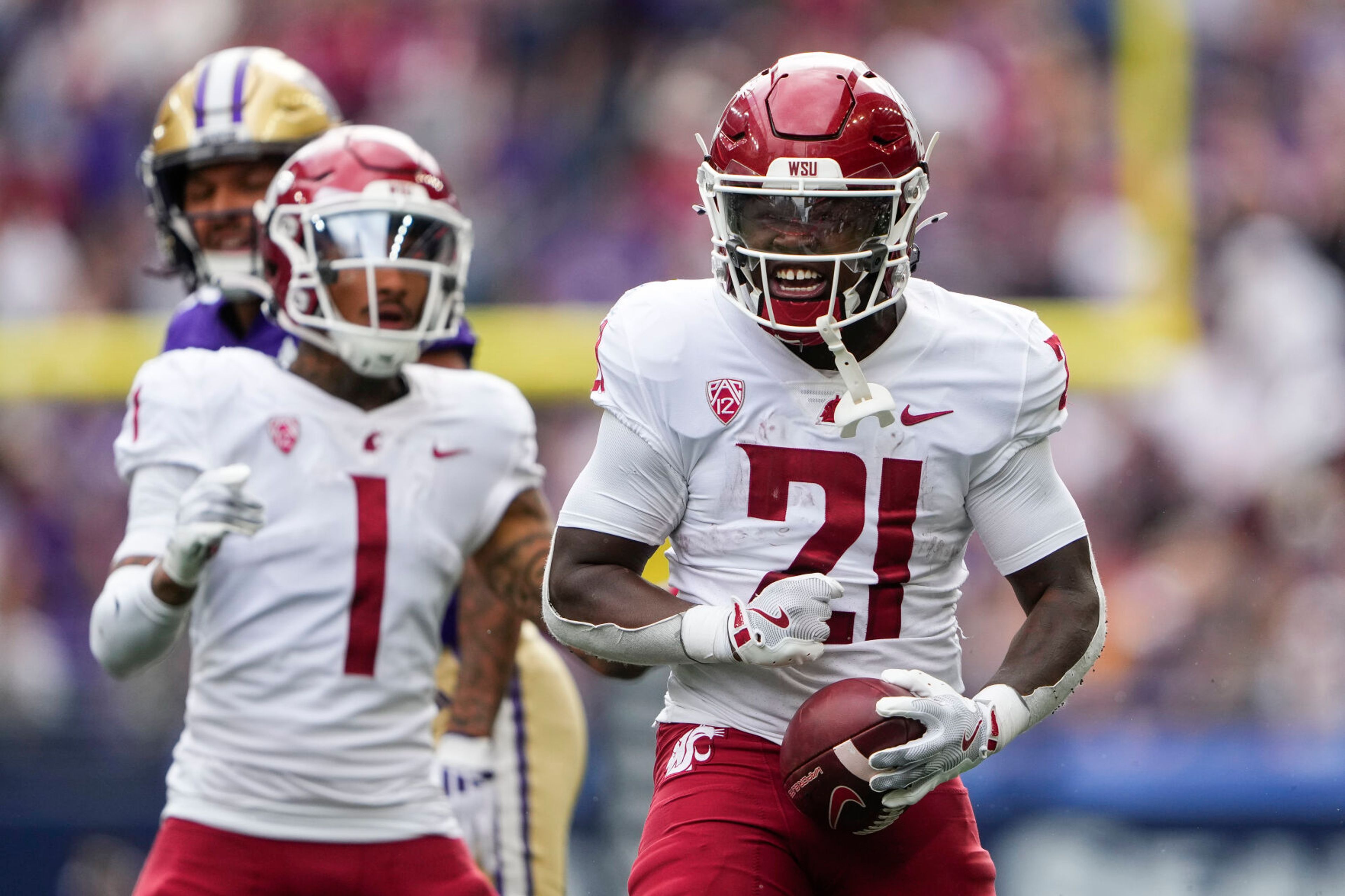 Washington State running back Wayshawn Parker (21) reacts to making a catch against Washington during the first half of an NCAA college football game Saturday, Sept. 14, 2024, in Seattle. (AP Photo/Lindsey Wasson)