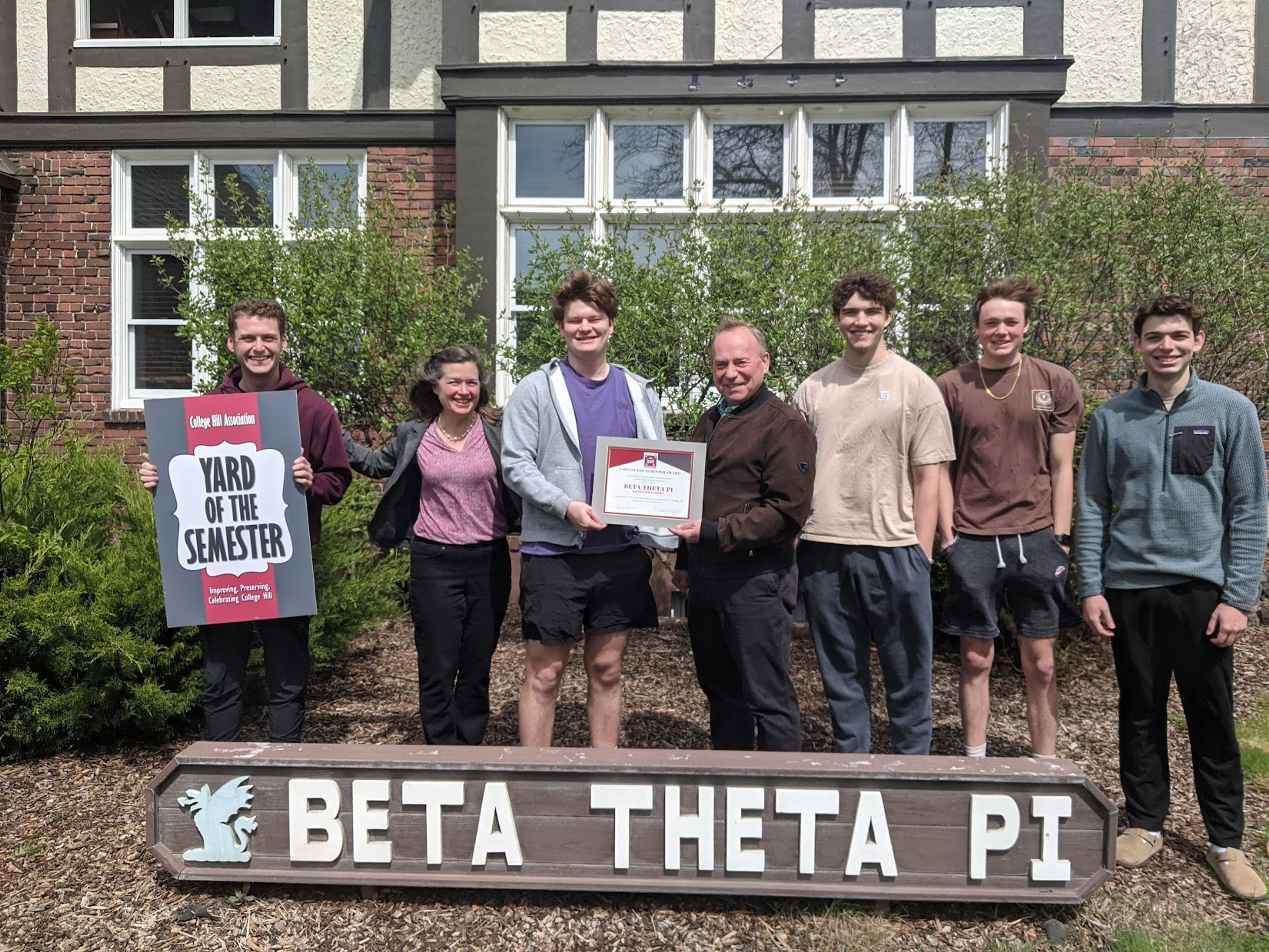 Washington State University's Beta Theta Pi fraternity was recognized as the Fraternity Yard of the Semester on April 21. On behalf of the College Hill Association and the City of Pullman, Mayor Francis Benjamin presents the award certificate to Chapter President Quinn Stauffacher while live-in adviser Jayden Patterson, holding the sign, Allison Munch-Rotolo of the College Hill Association, and chapter residents look on. The chapter is at 820 NE Linden St. in Pullman.