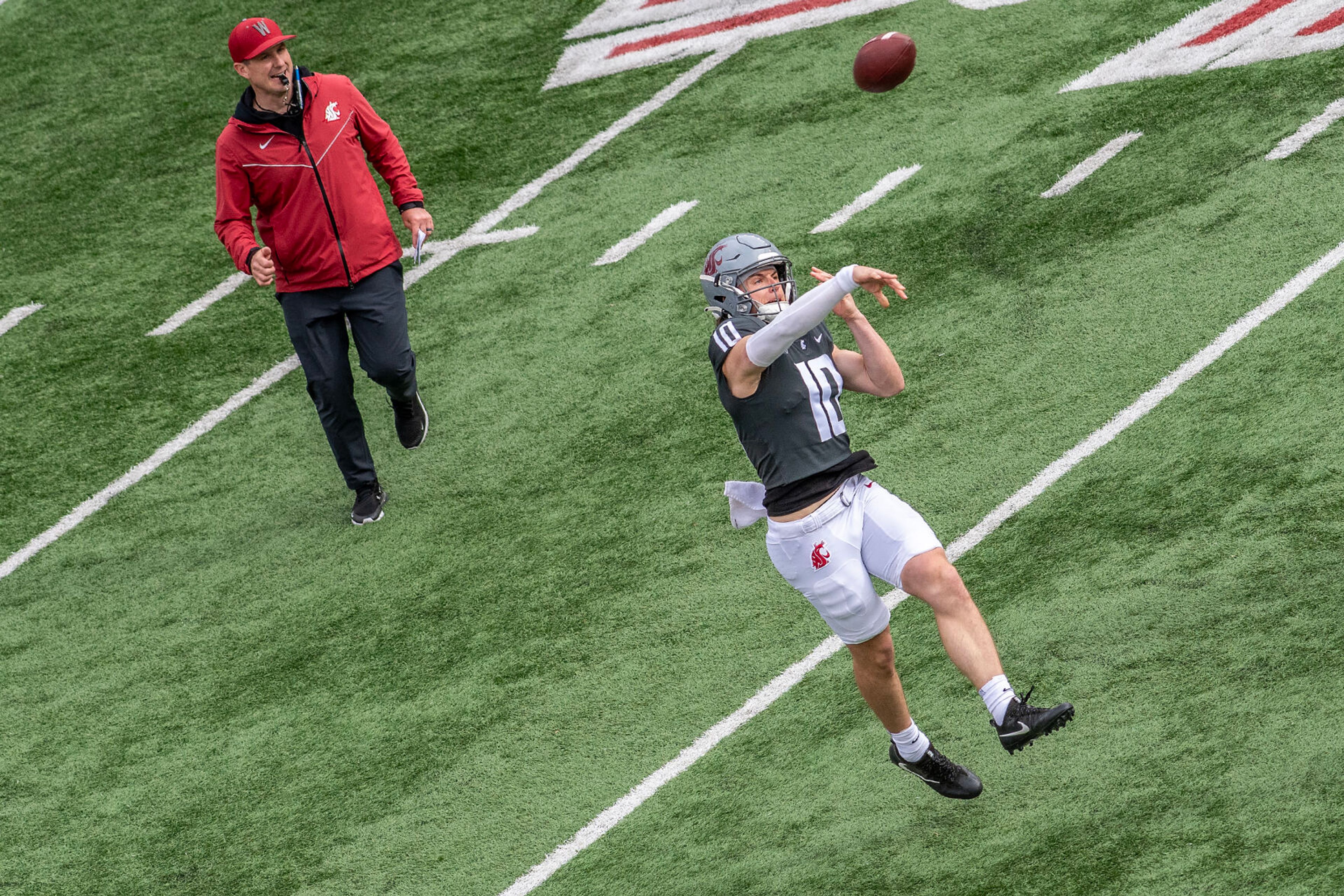 Quarterback John Mateer throws a pass in a quarter of the Crimson and Gray Game at Washington State University in Pullman.