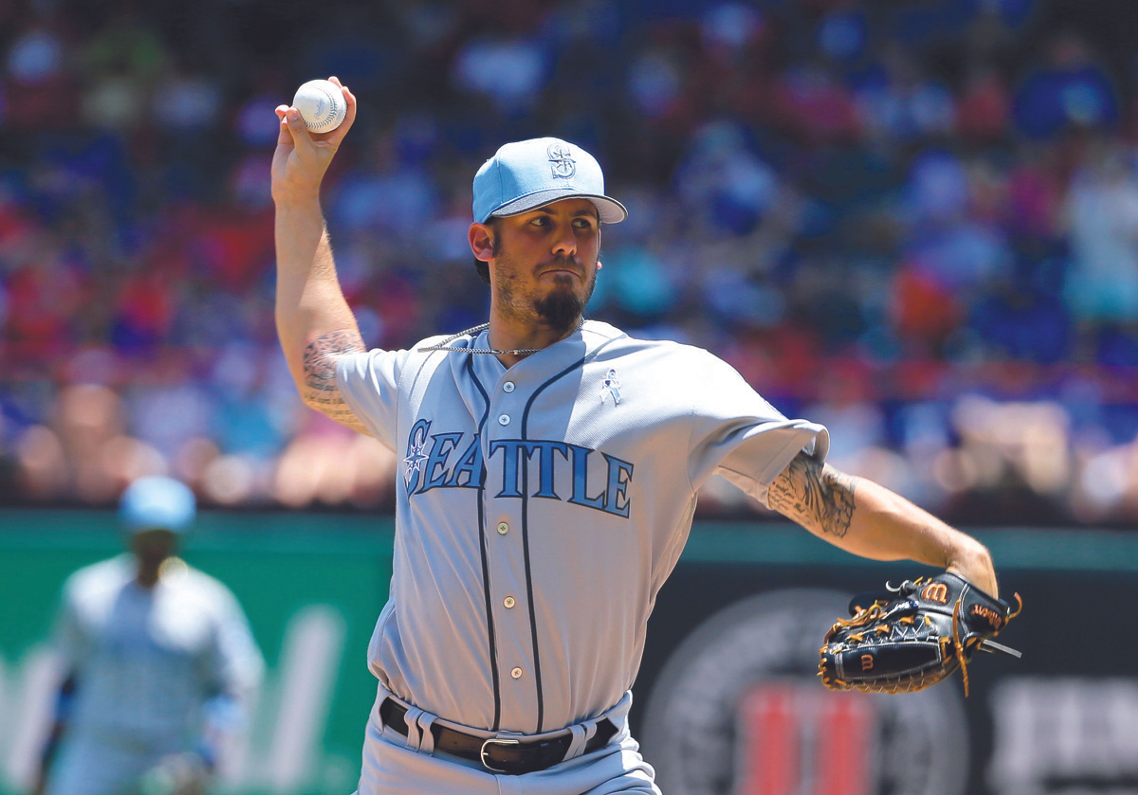 Seattle Mariners starting pitcher Christian Bergman throws to the Texas Rangers in the first inning of a baseball game, Sunday, June 18, 2017, in Arlington, Texas.