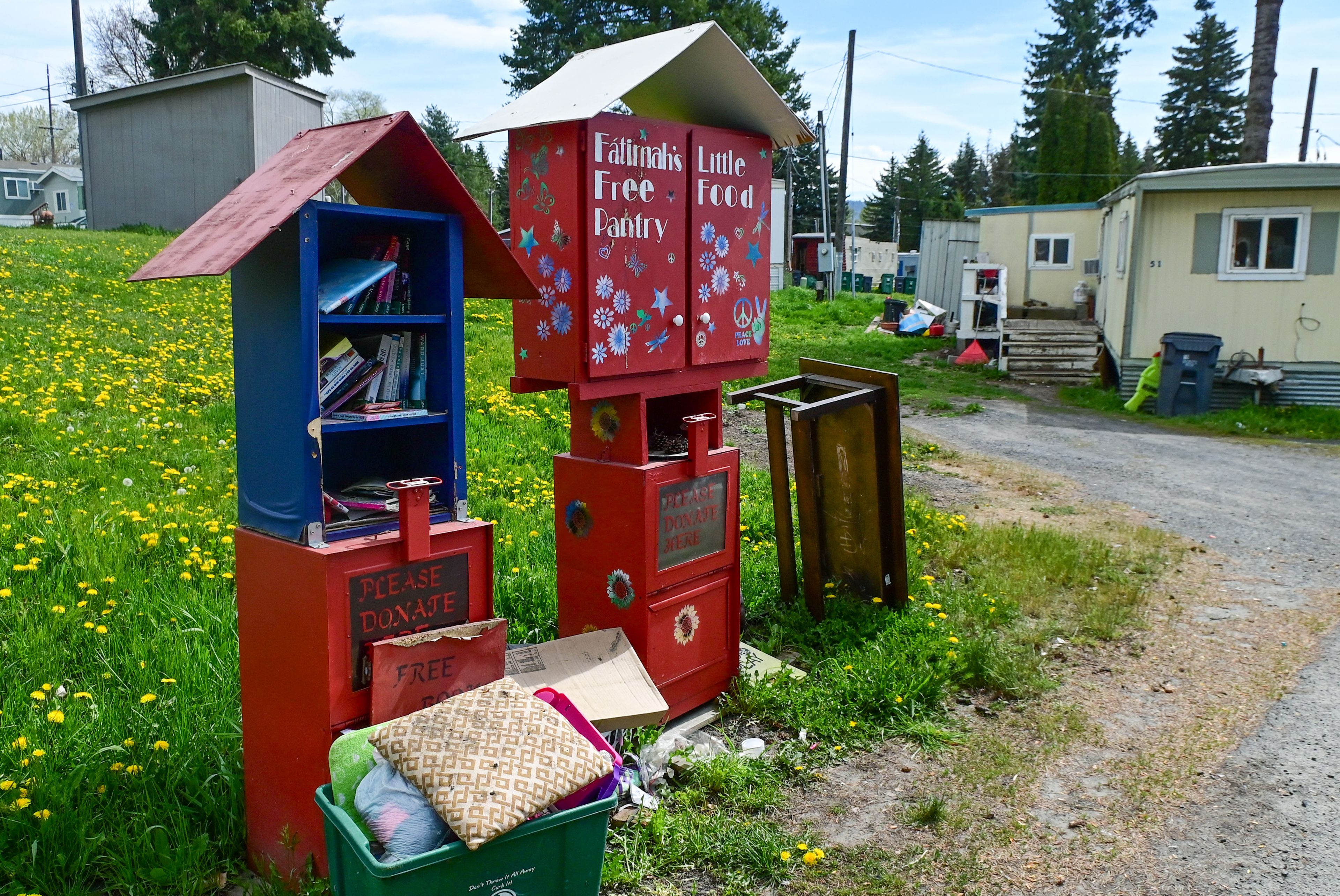 A free pantry and library stands in the Abiel Mobile Home Community in Moscow on Thursday. Residents say they are facing rising rent increases at the mobile home park.