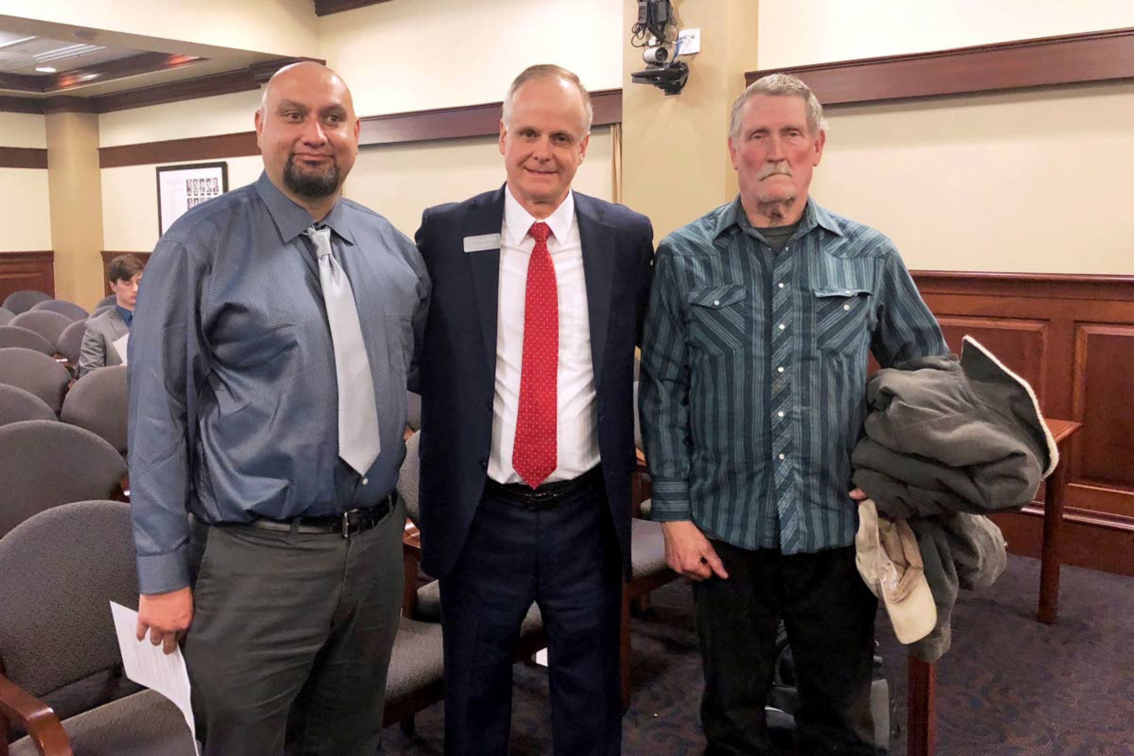 Associated PressIn this Feb. 11, 2020, file photo, from left, Christopher Tapp, Republican Rep. Doug Ricks and Charles Fain appear before the Idaho House Judiciary, Rules and Administration Committee, to testify in favor of legislation that would compensate the wrongly convicted.