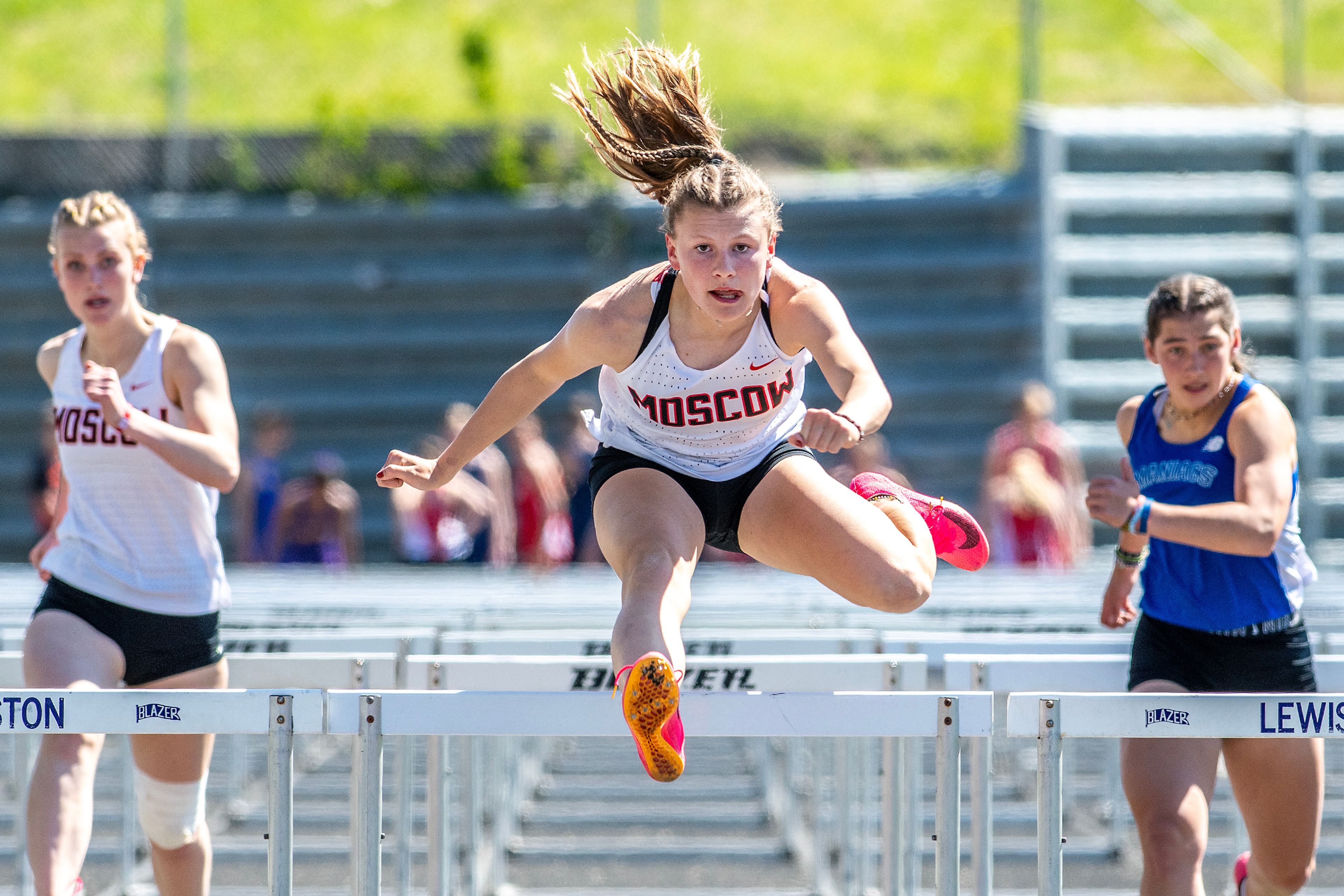 Moscow’s Mattea Nuhn clears the final hurdle as she runs in for first place in the 100-meter hurdles Thursday at the Meet of Champions at Sweeney Track and Vollmer Bowl in Lewiston.