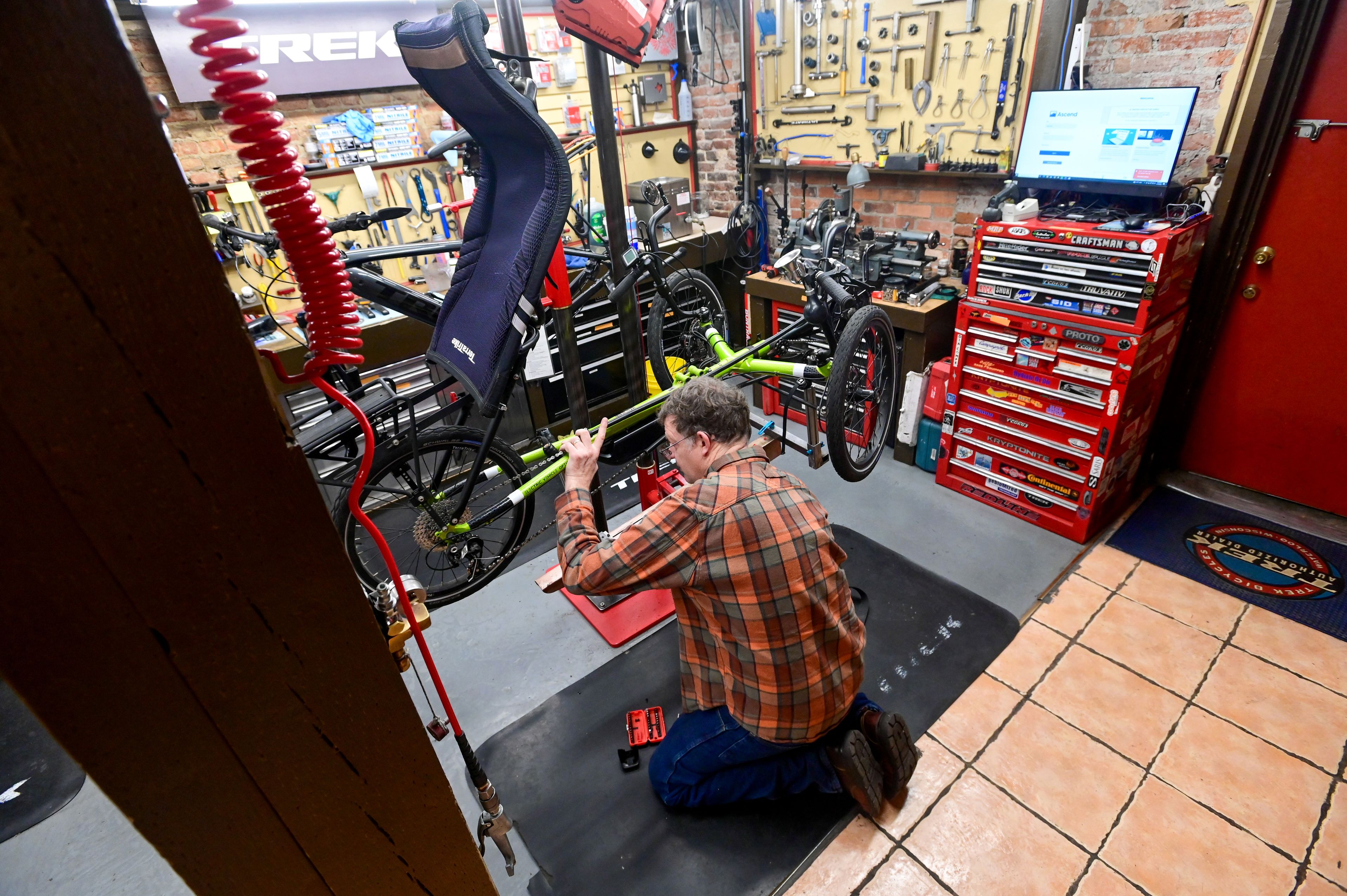 B&L Bicycles owner Brice Erickson investigates a problem on a bike brought into the store on Wednesday, Nov. 15 in downtown Pullman.