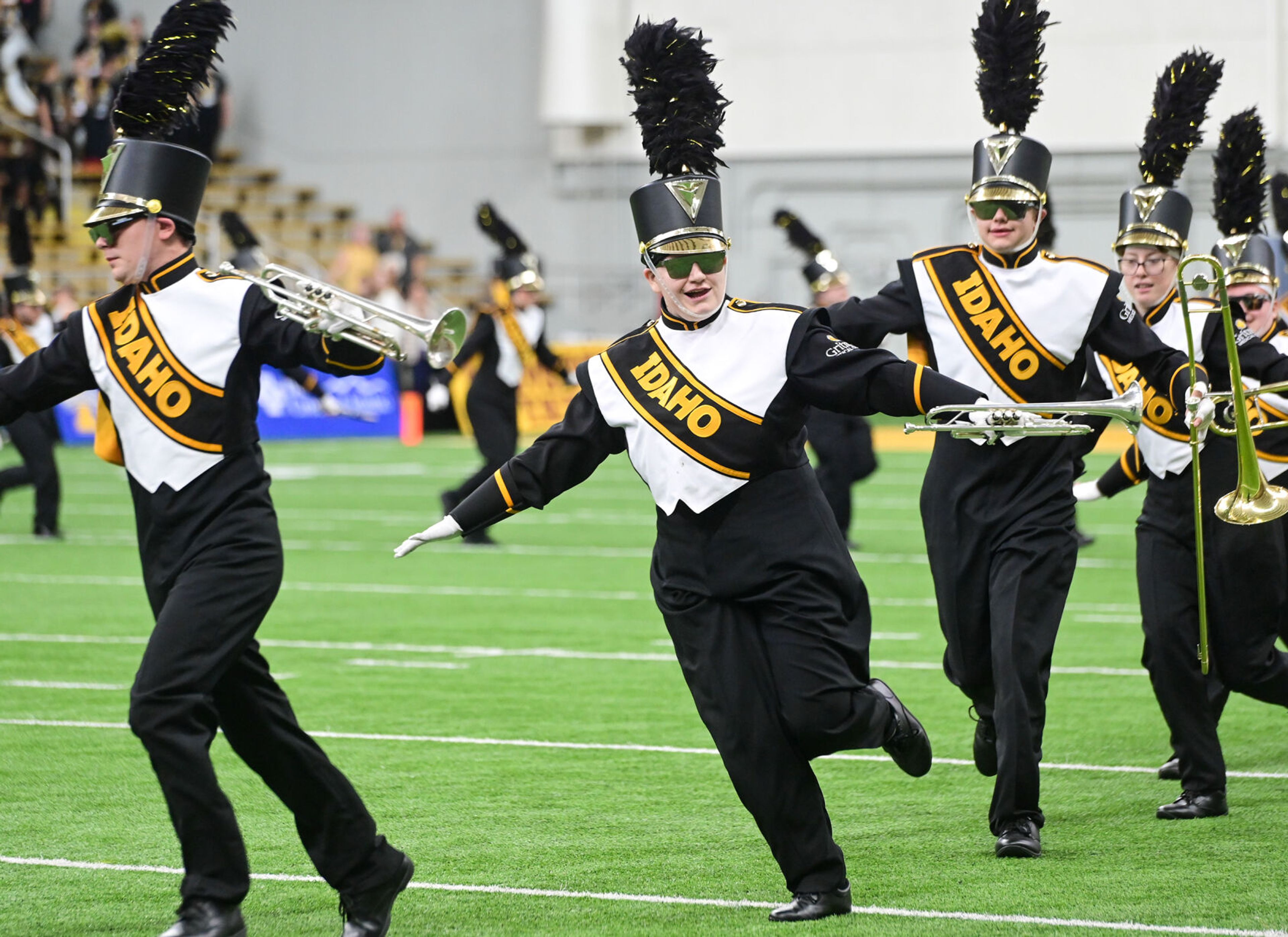 Members of Idaho's Vandal Marching Band spread their arms tp move across the field before the Vandals play UAlbany Saturday at the P1FCU Kibbie Dome in Moscow.