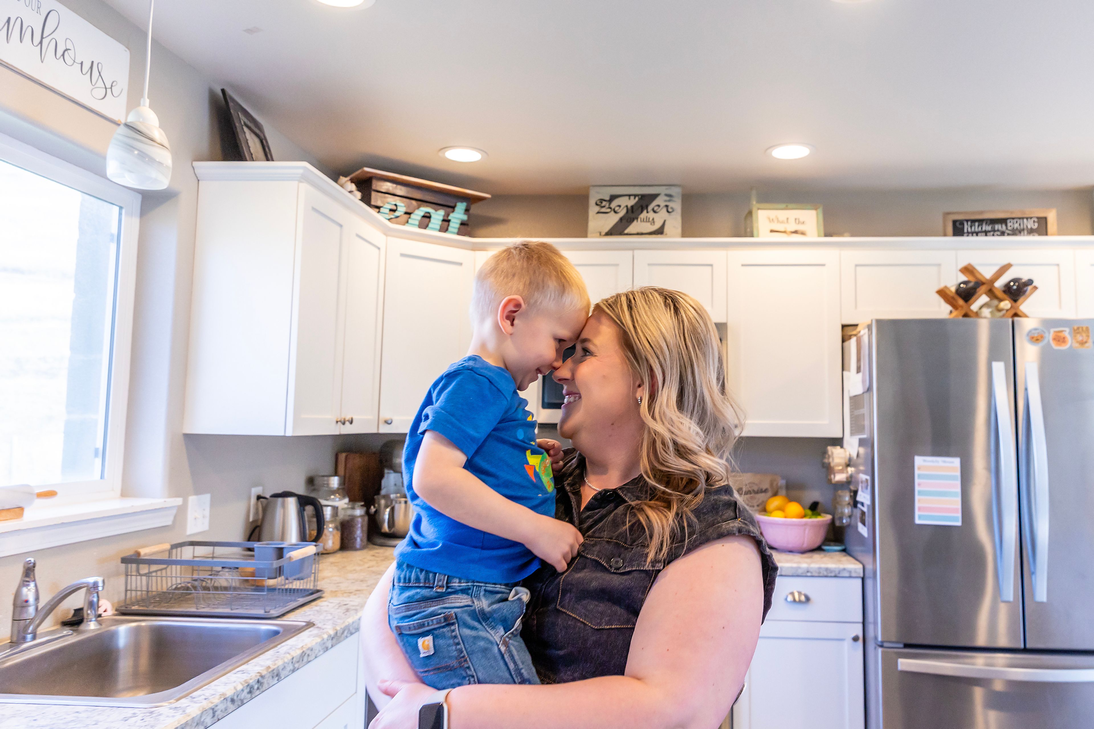 Kayla Zenner holds her younger son, Weston Zenner, 3, last week at her home near Culdesac.