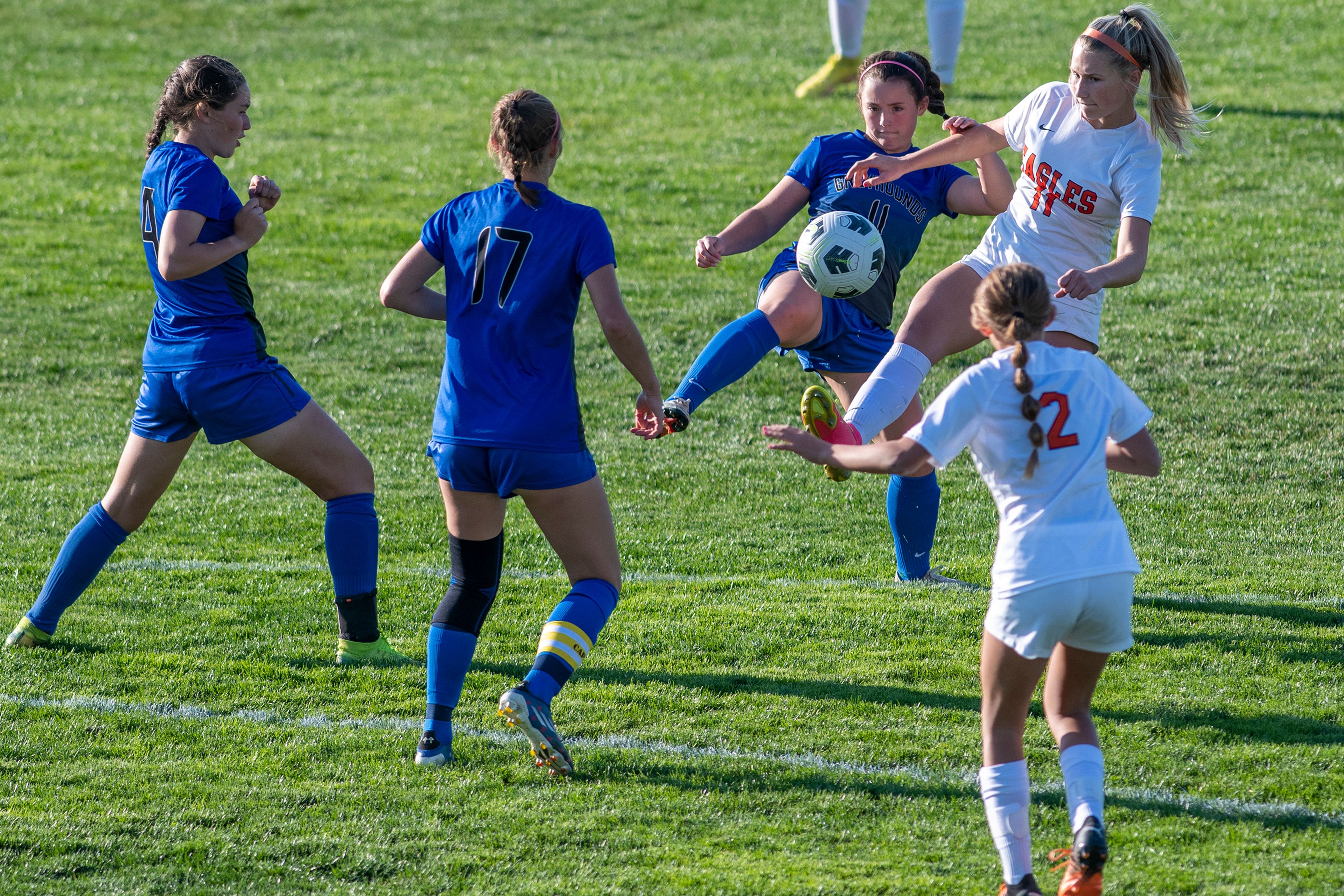 Pullman’s Kyla Schulenberger (11) fights for possession of the ball against West Valley’s Ashlyn Chase (11) during a Class 2A Greater Spokane League game at Pullman High School on Tuesday.