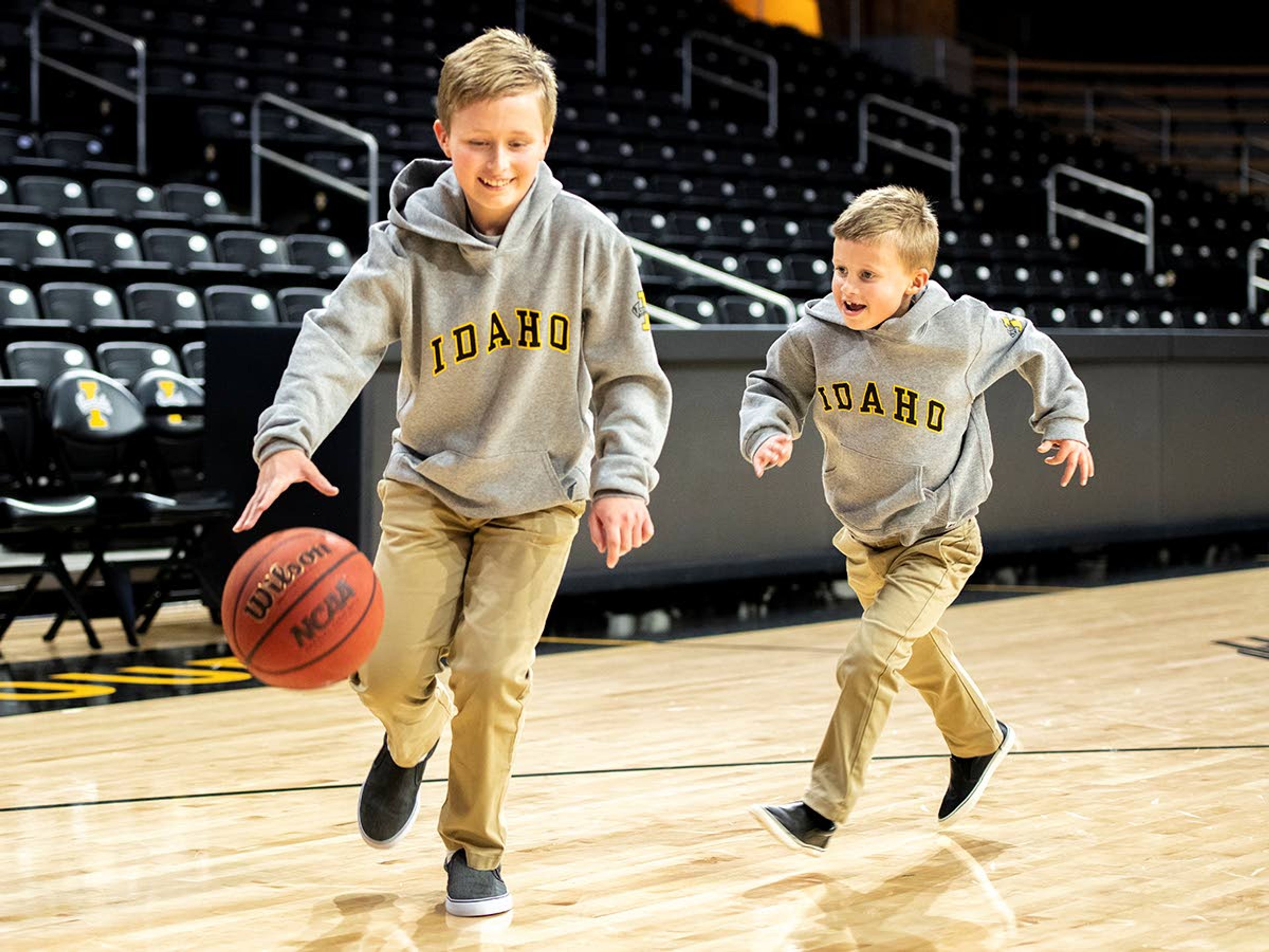 Palmer Eck, left, and Maverick Eck, sons of University of Idaho head football coach Jason Eck, shoot hoops on Idaho Central Credit Union Arena’s court following Eck’s introductory press conference on Monday afternoon.