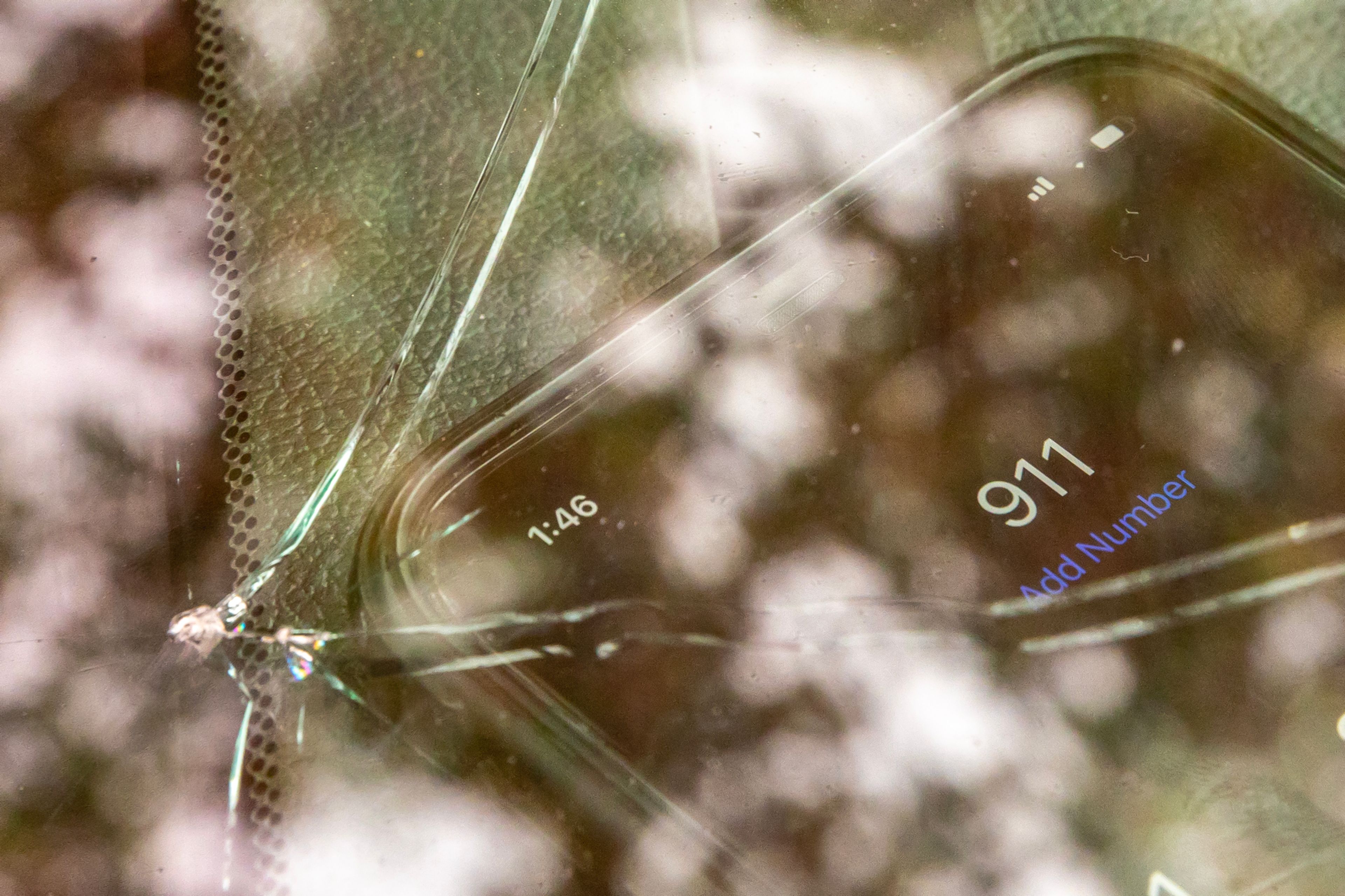 A iPhone is pictured next to a cracked windshield Tuesday in Lewiston.