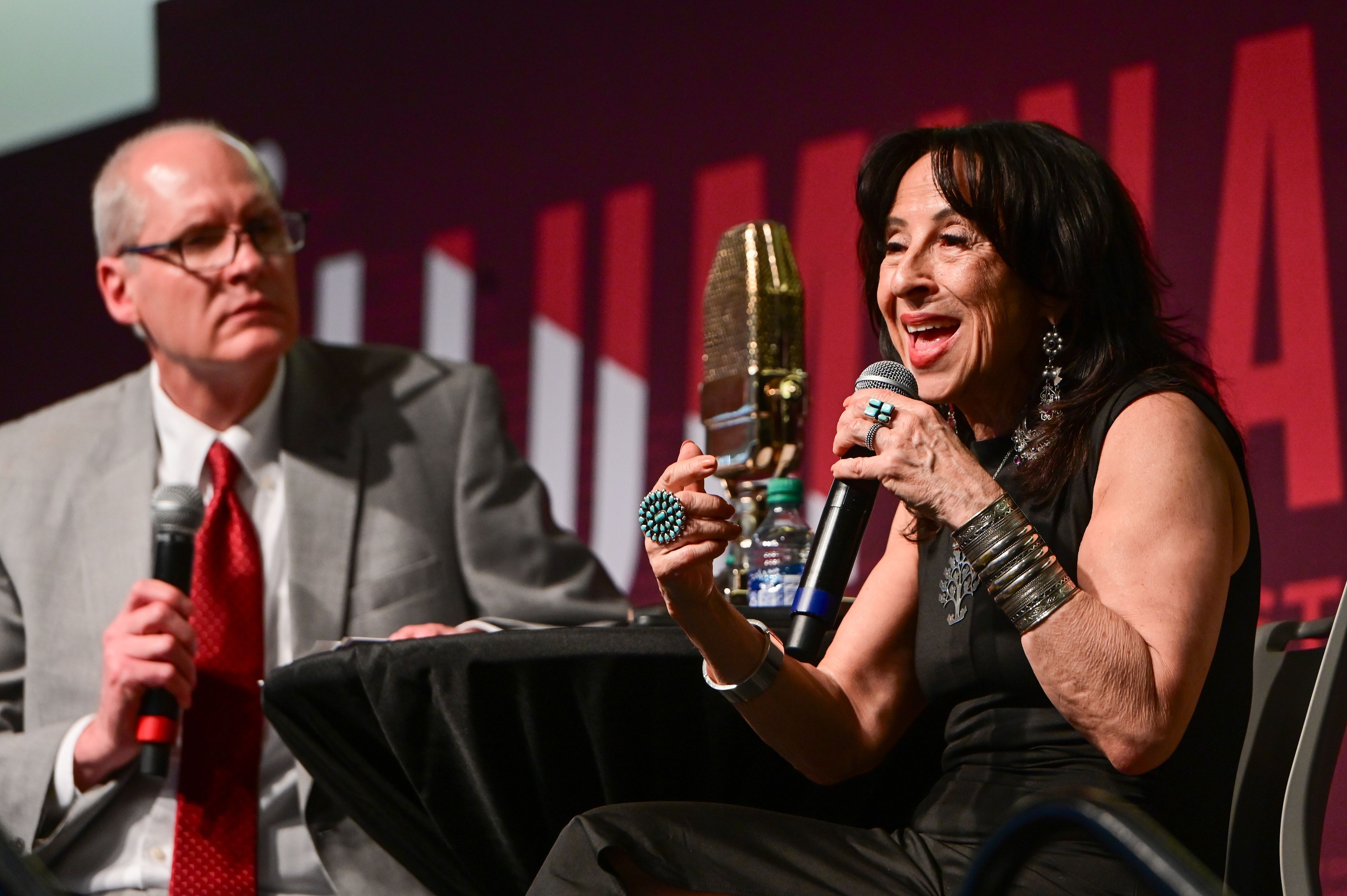 Bruce Pinkleton, left, dean of the Edward R. Murrow College of Communication, listens as Maria Hinojosa, right, answers questions after her keynote at the Murrow Symposium in Pullman on Wednesday. Hinojosa is the 2024 recipient of the Murrow Lifetime Achievement Award.