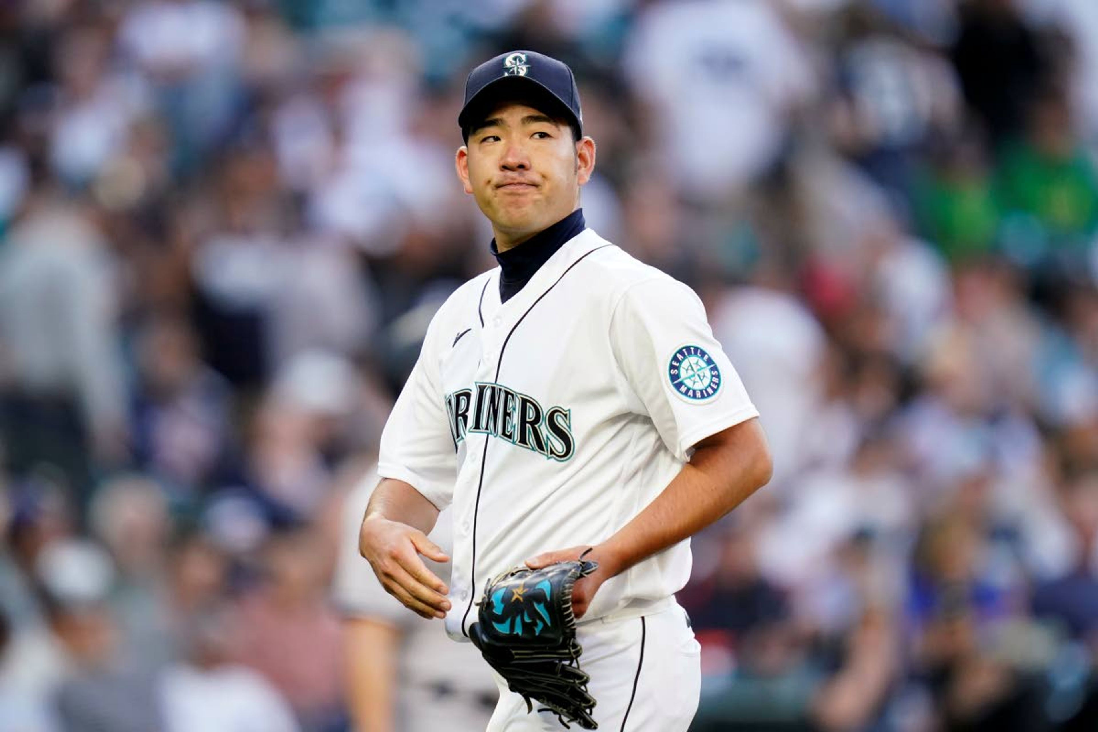 Seattle Mariners starting pitcher Yusei Kikuchi heads to the dugout after giving up a pair of runs in the second inning to the New York Yankees in a baseball game Wednesday, July 7, 2021, in Seattle. (AP Photo/Elaine Thompson)