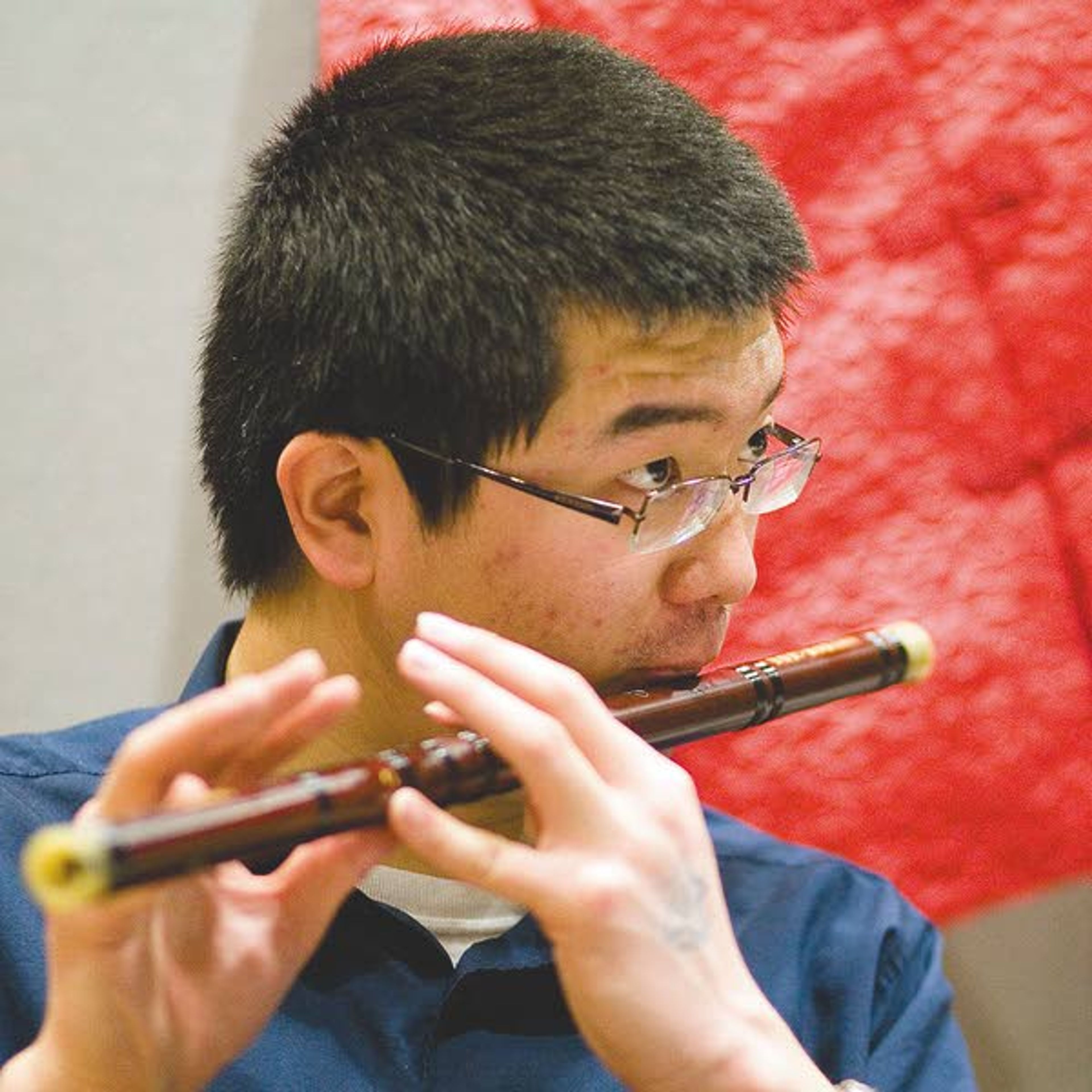 University of Idaho student Frank Guo plays a folk song on a traditional Chinese flute during Cruise The World at the Student Union Building in Moscow on Saturday.