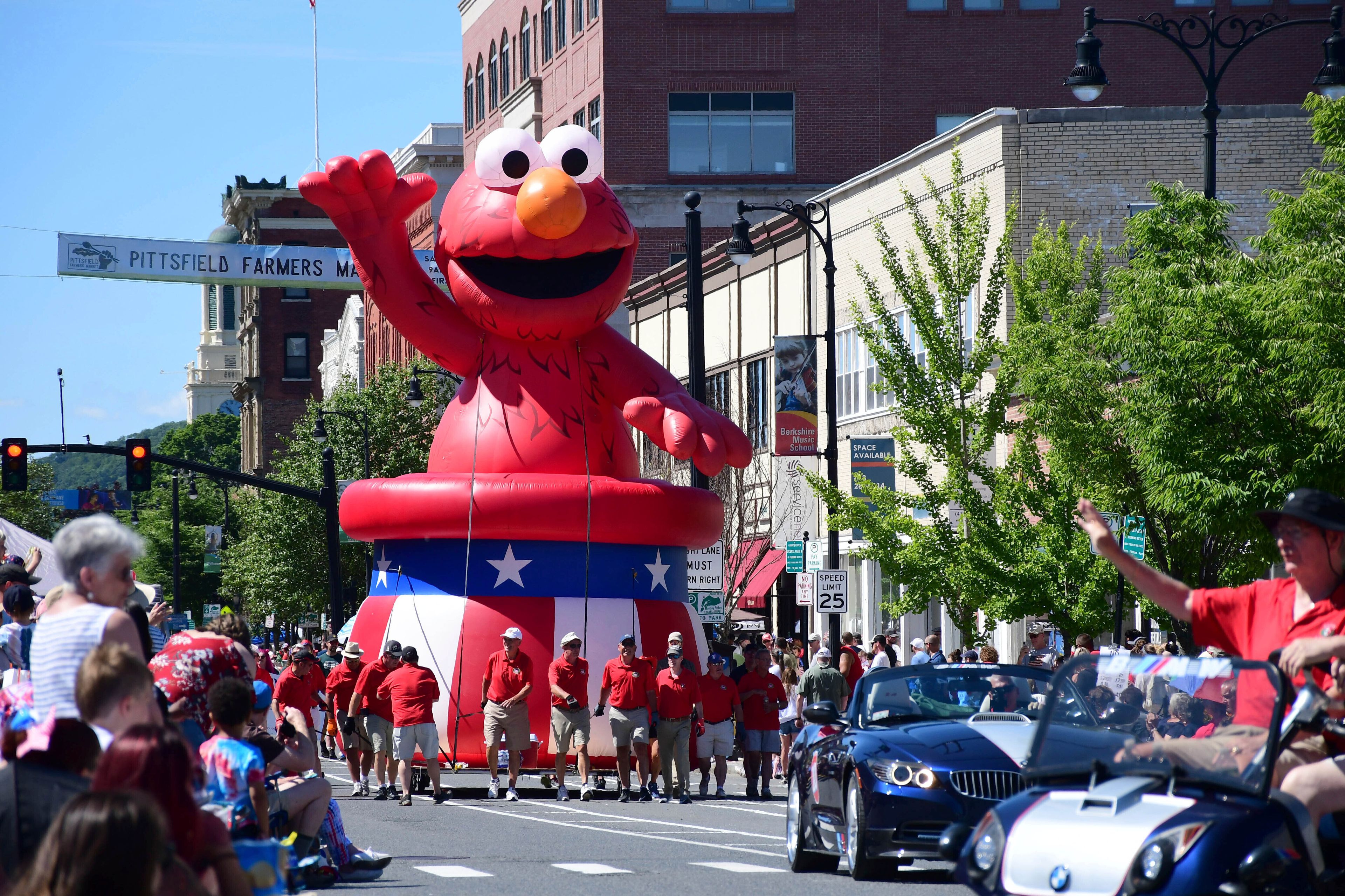 Sesame Street's Elmo float is carried through the Pittsfield Fourth of July parade in Pittsfield, Mass., on Monday, July, 4, 2022. (Gillian L. Jones/The Berkshire Eagle via AP)