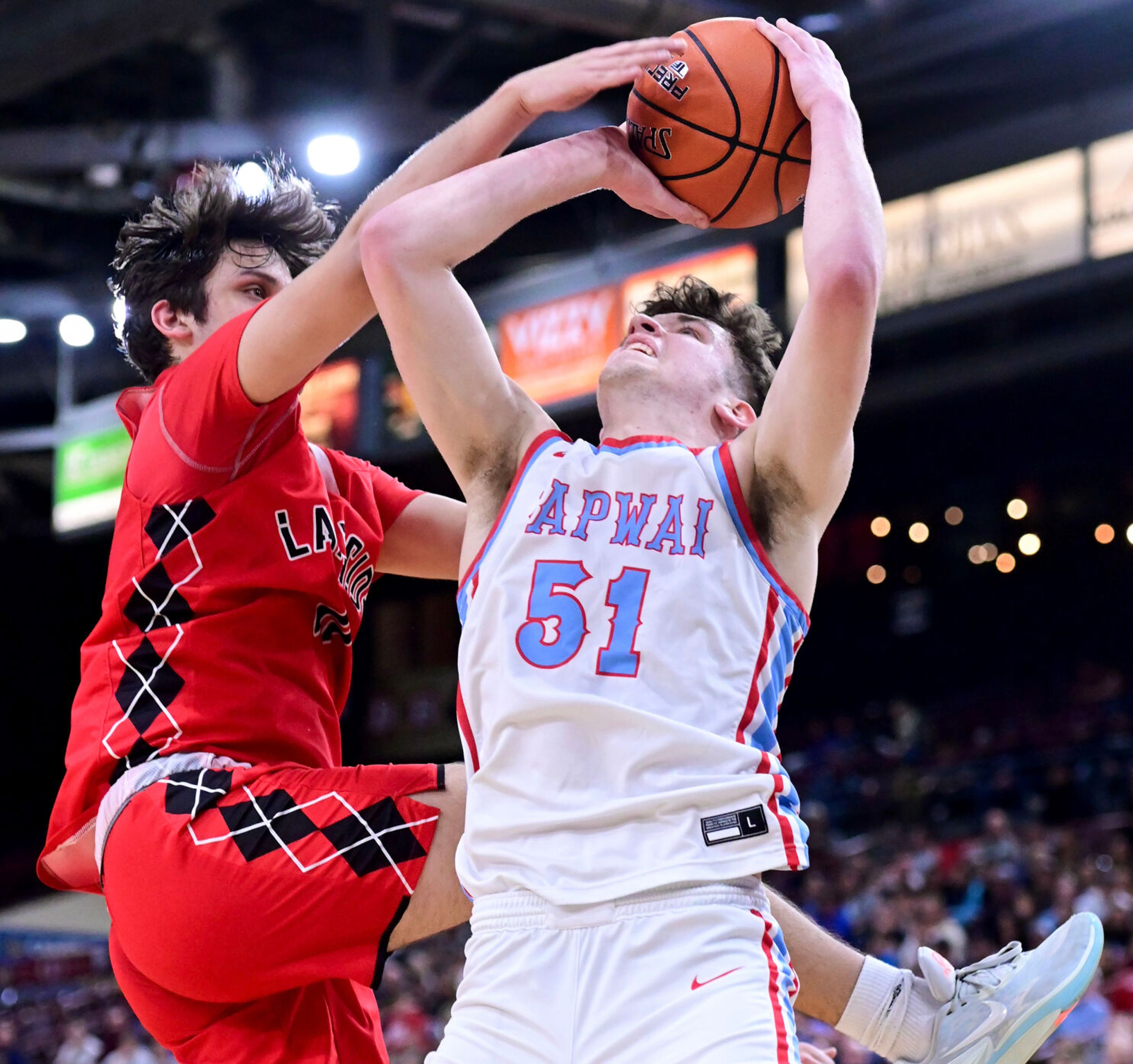 Lapwai point guard Kase Wynott is blocked from a two-point shot by Lakeside’s Liam Hendrix during a state championship game at the Ford Idaho Center in Nampa on Saturday.