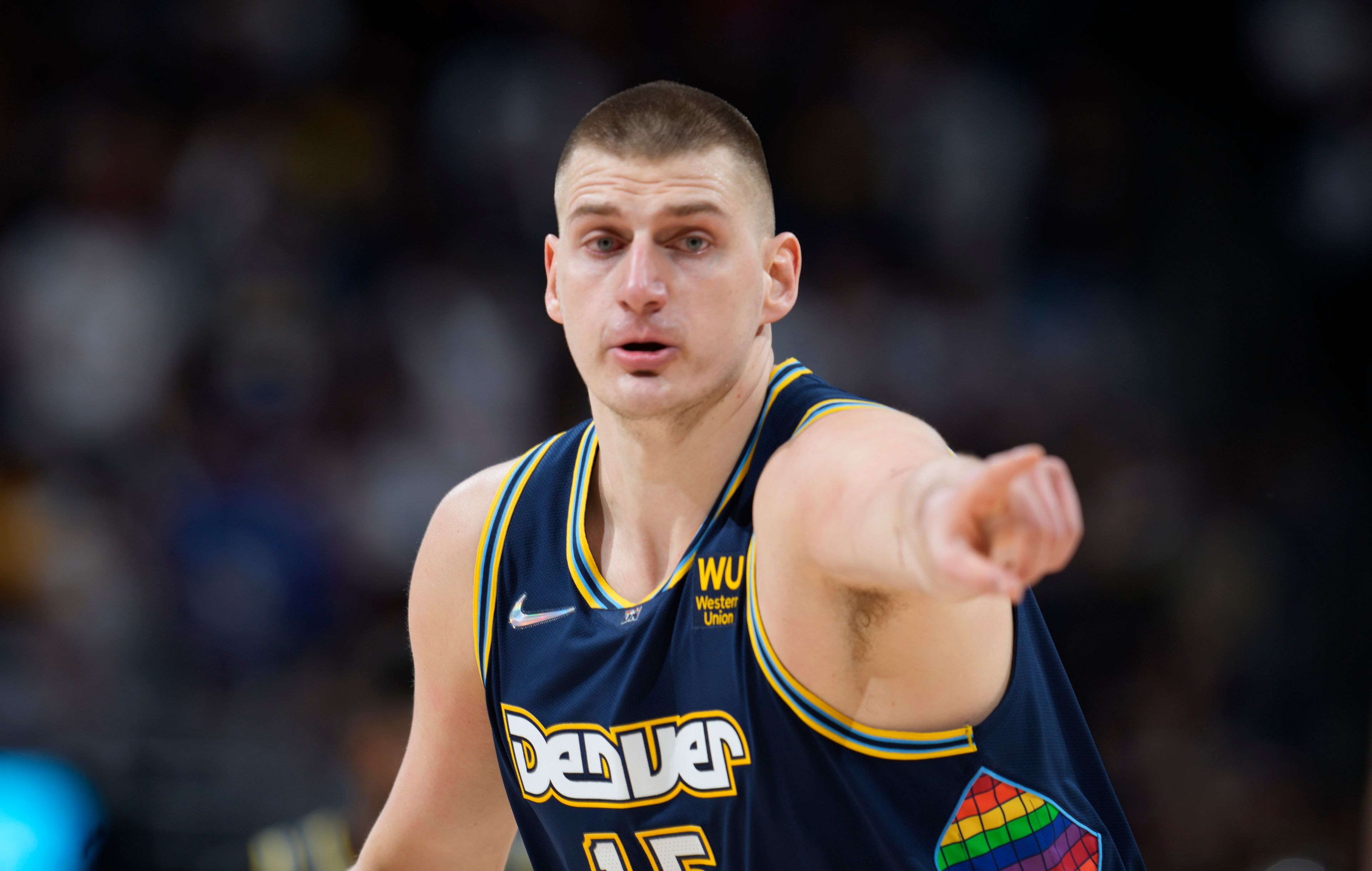 Denver Nuggets center Nikola Jokic gestures after hitting a 3-point basket against the Golden State Warriors in the first half of Game 4 of an NBA basketball first-round Western Conference playoff series Sunday, April 24, 2022, in Denver. (AP Photo/David Zalubowski)